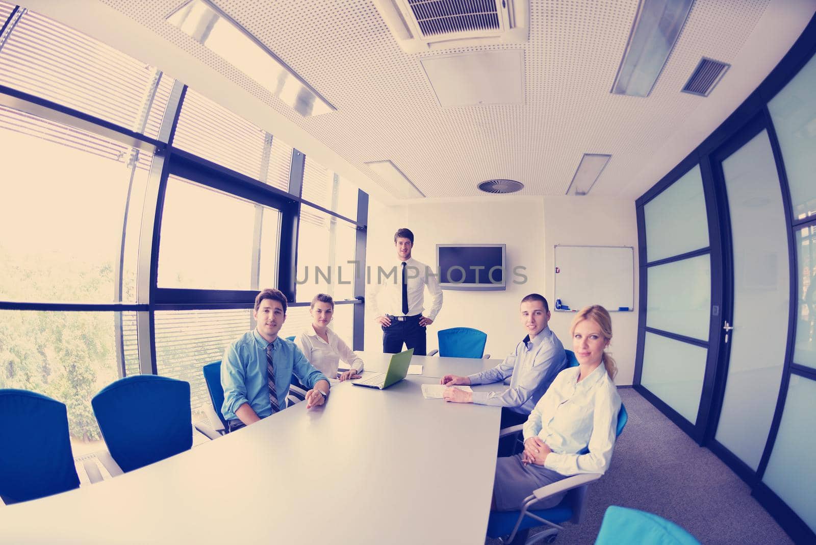 Group of happy young  business people in a meeting at office