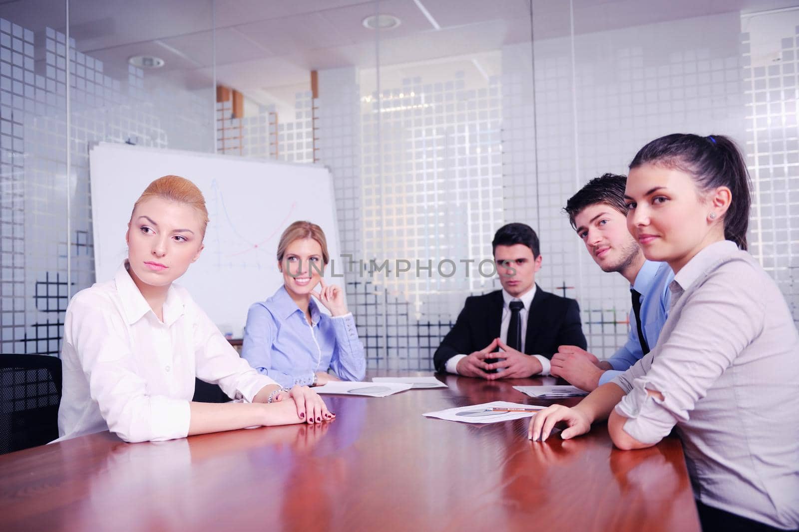 Group of happy young  business people in a meeting at office