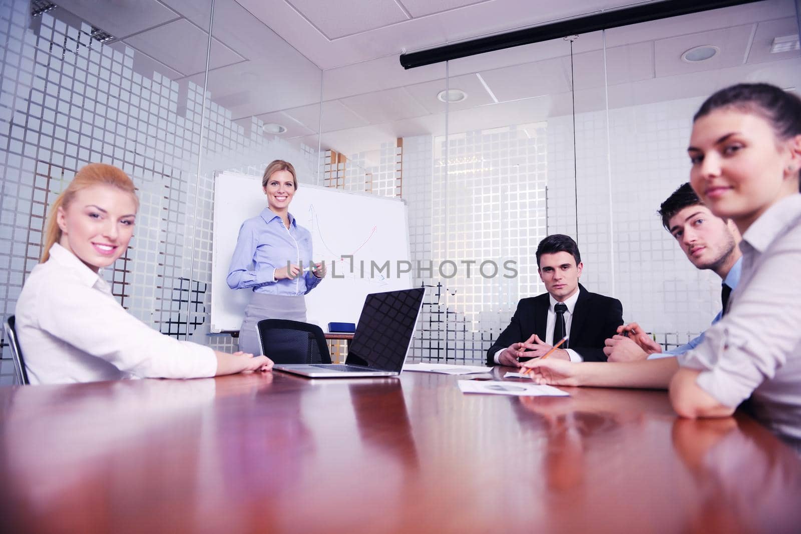 Group of happy young  business people in a meeting at office