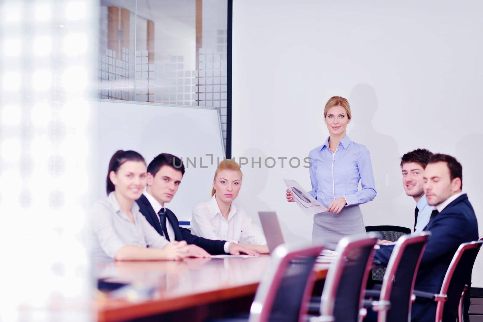 Group of happy young  business people in a meeting at office