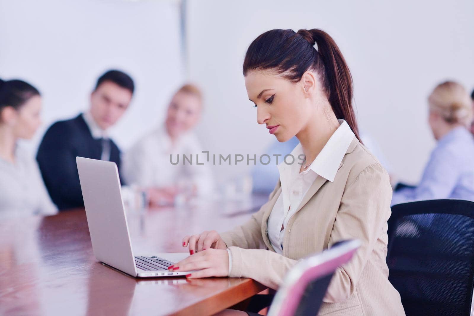 Group of happy young  business people in a meeting at office