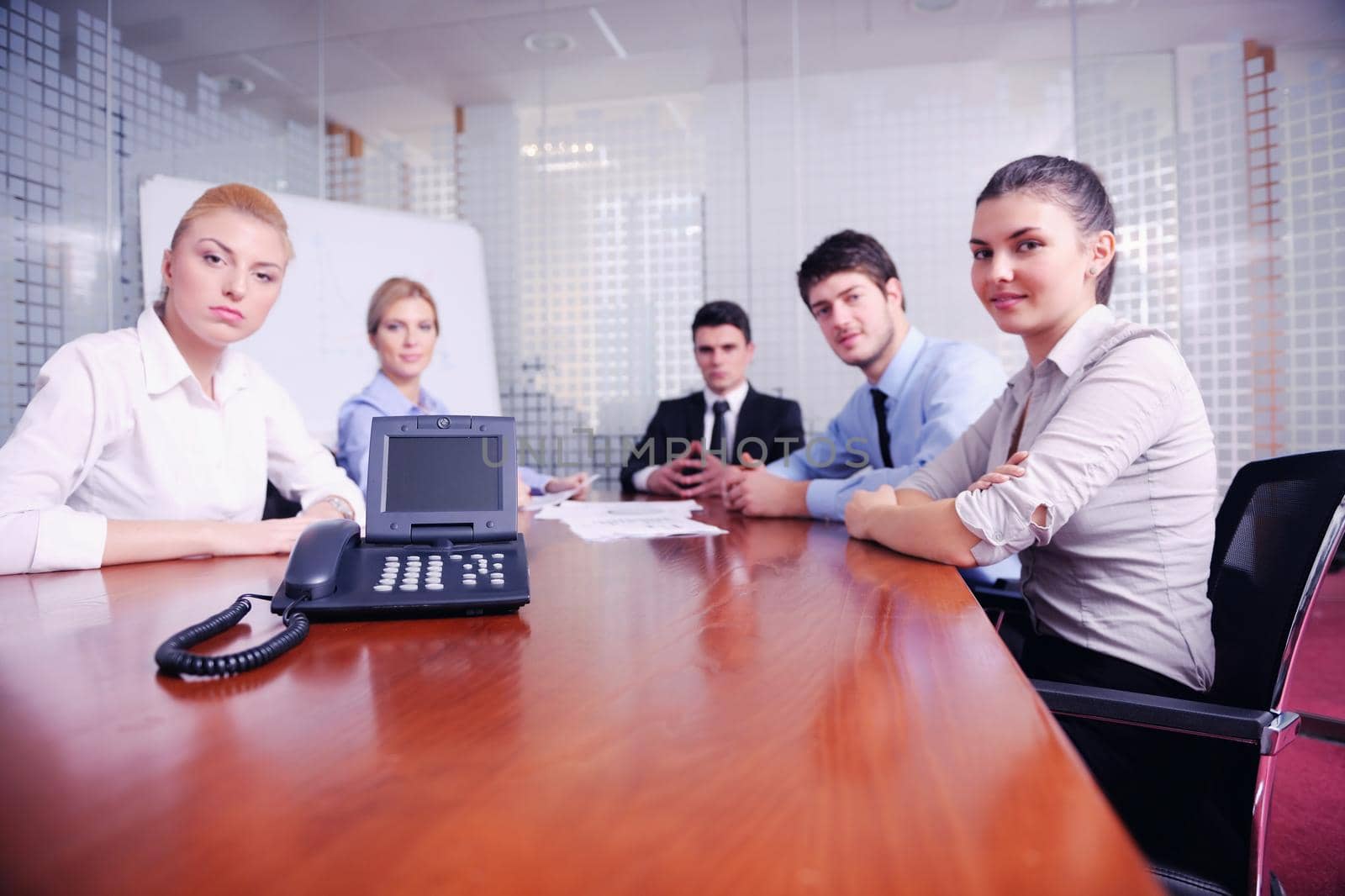 business people in a video meeting by dotshock