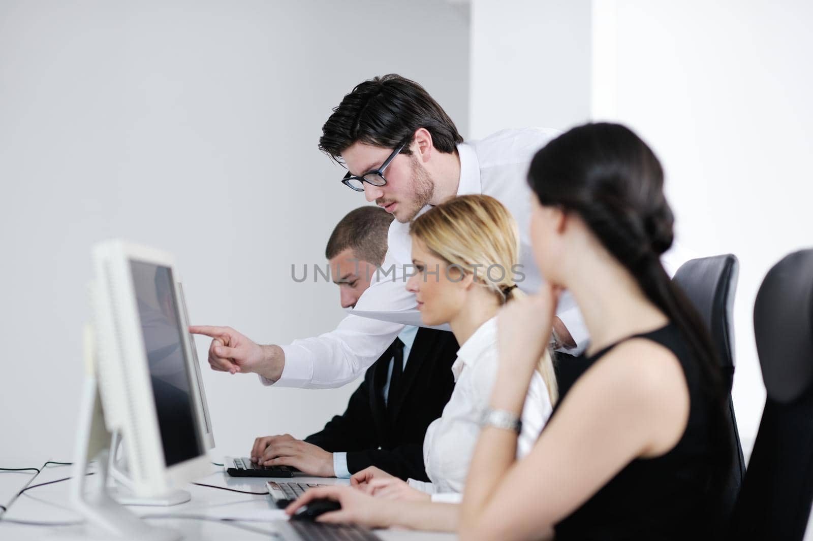 business people group with  headphones giving support in  help desk office to customers, manager giving training and education instructions