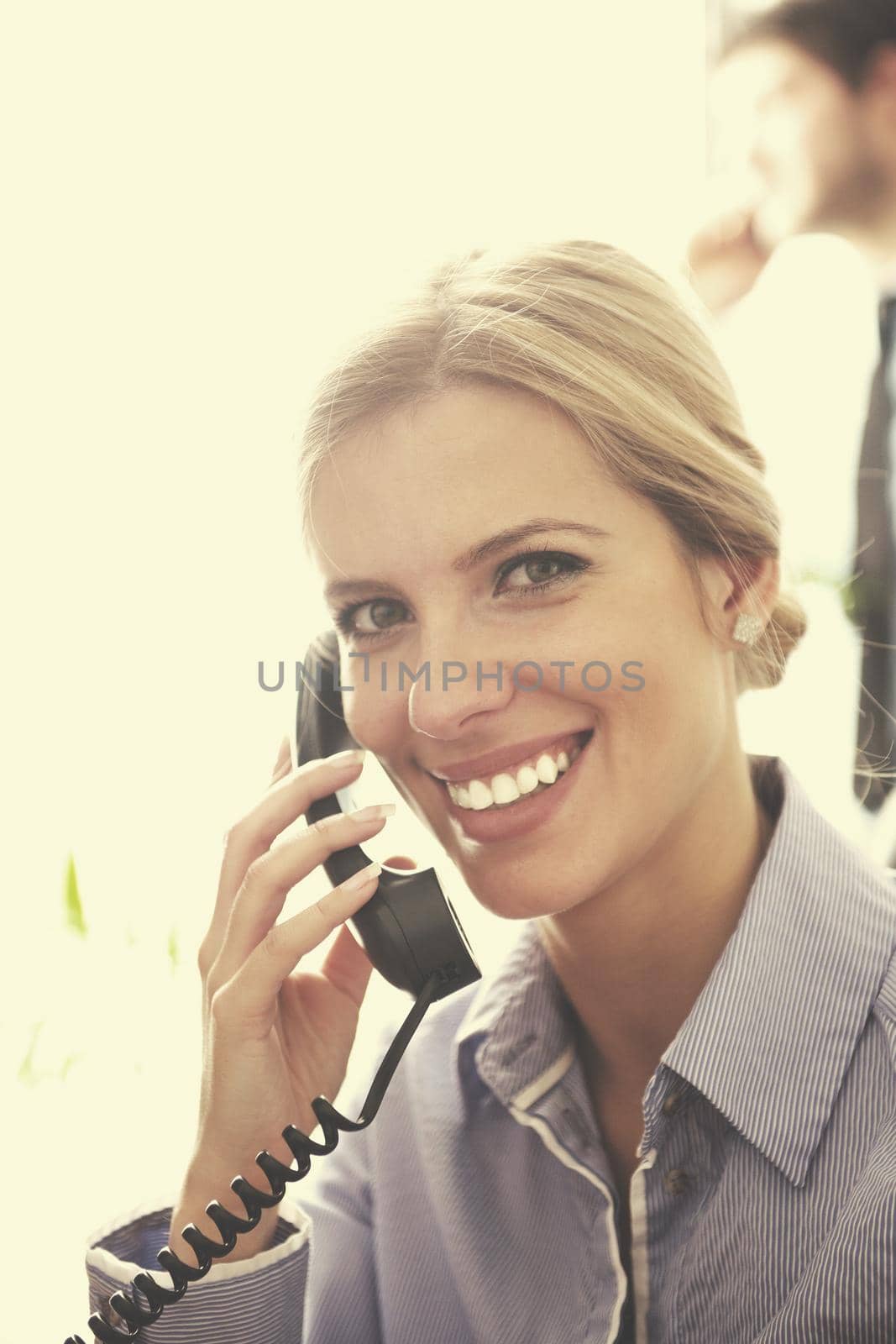 Portrait of a beautiful business woman talk by phone