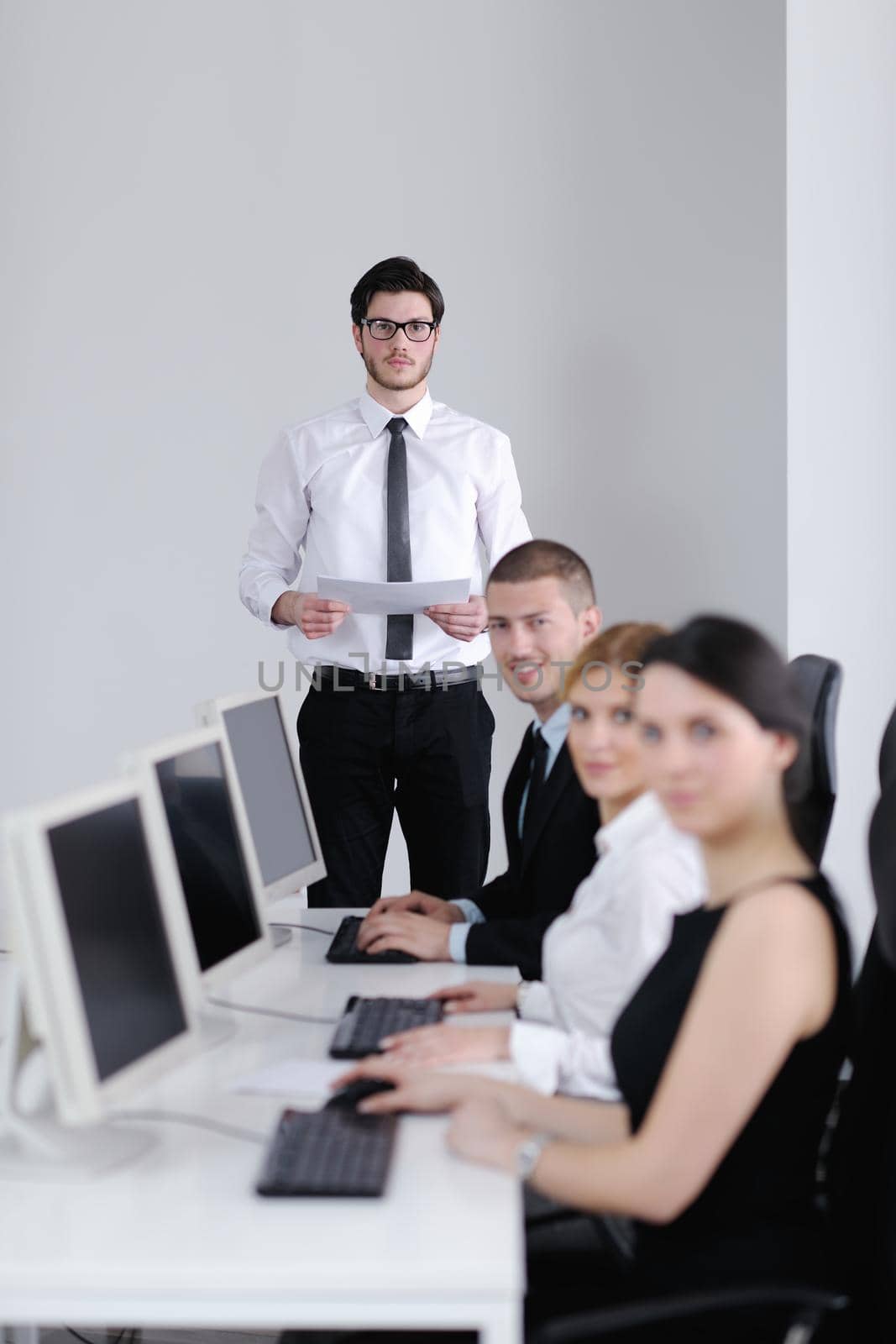 business people group with  headphones giving support in  help desk office to customers, manager giving training and education instructions