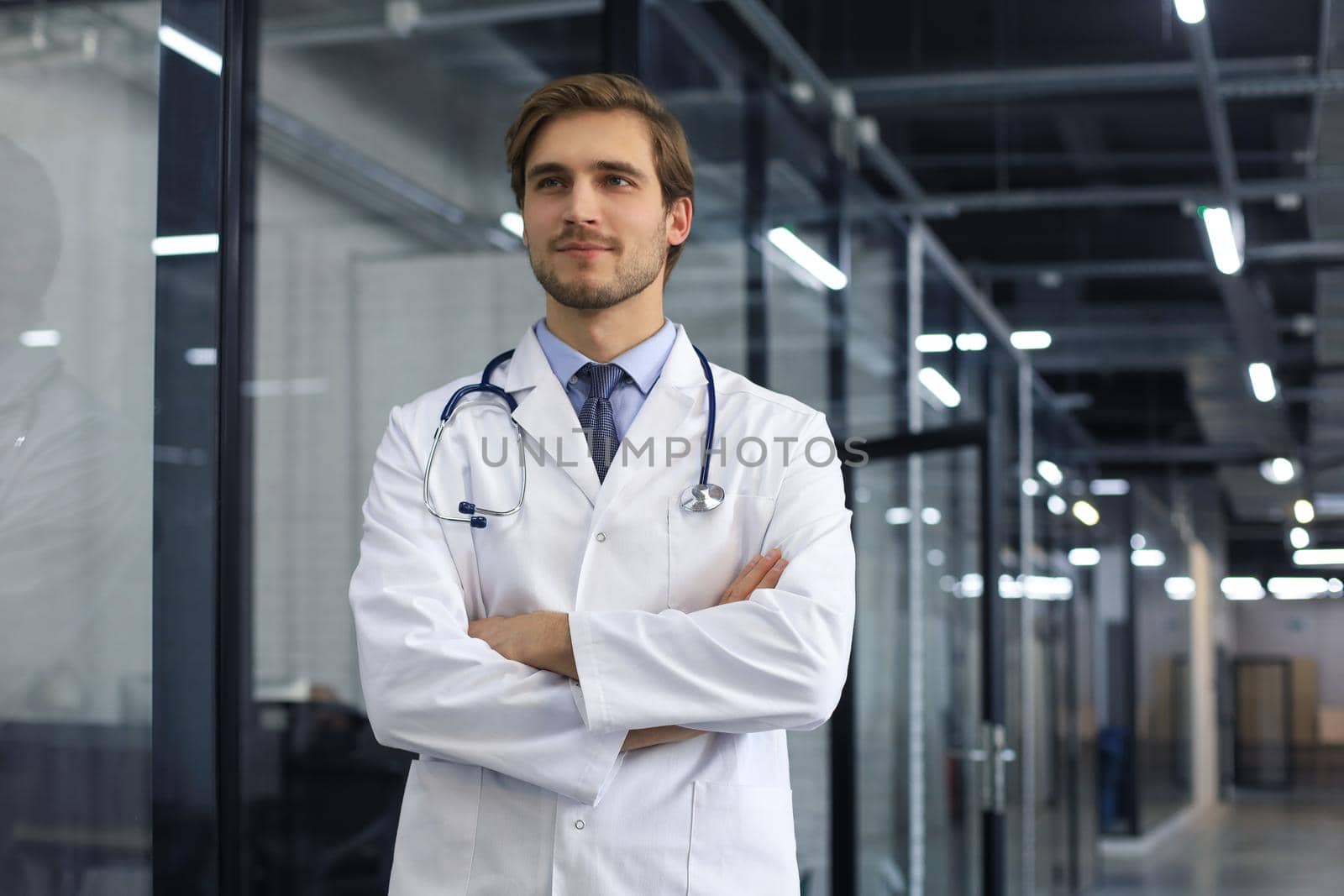 Portrait of young male doctor with stethoscope, close up