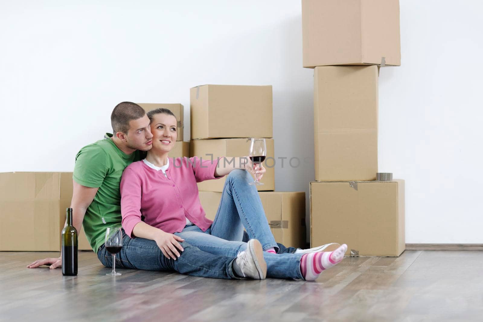 Young couple moving in new home by dotshock