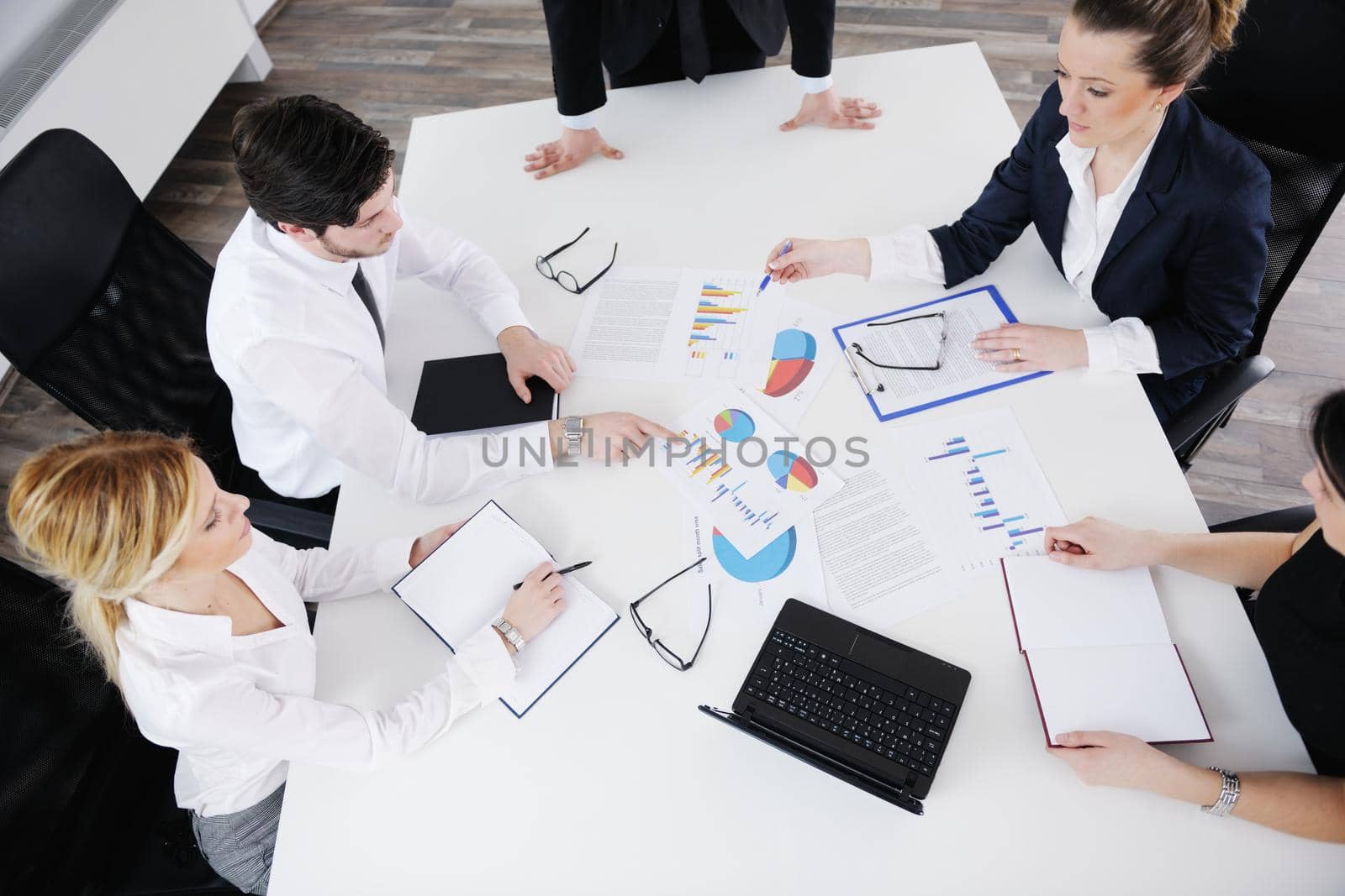 Group of happy young  business people in a meeting at office