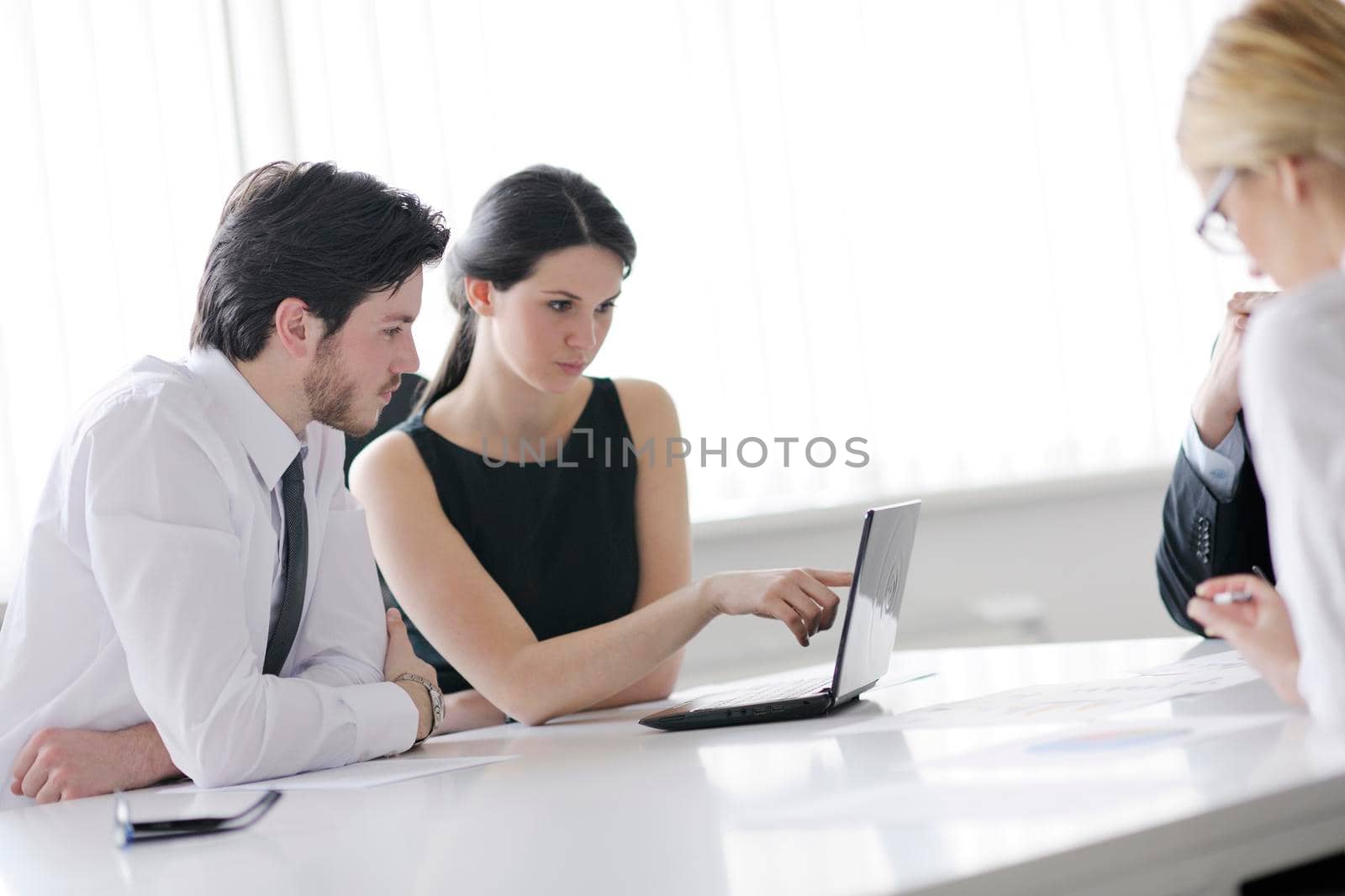 Group of happy young  business people in a meeting at office