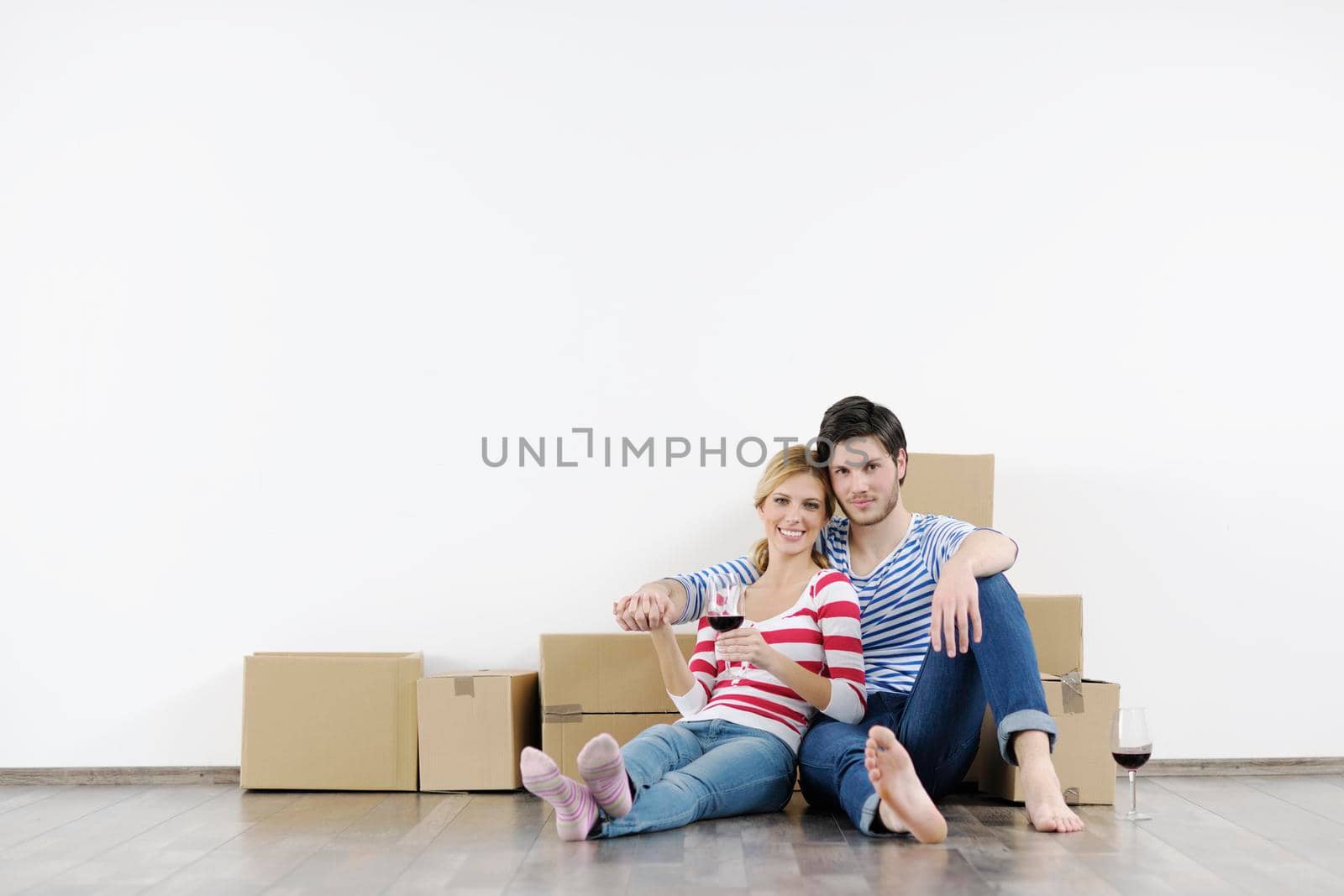 Young couple moving in new home by dotshock