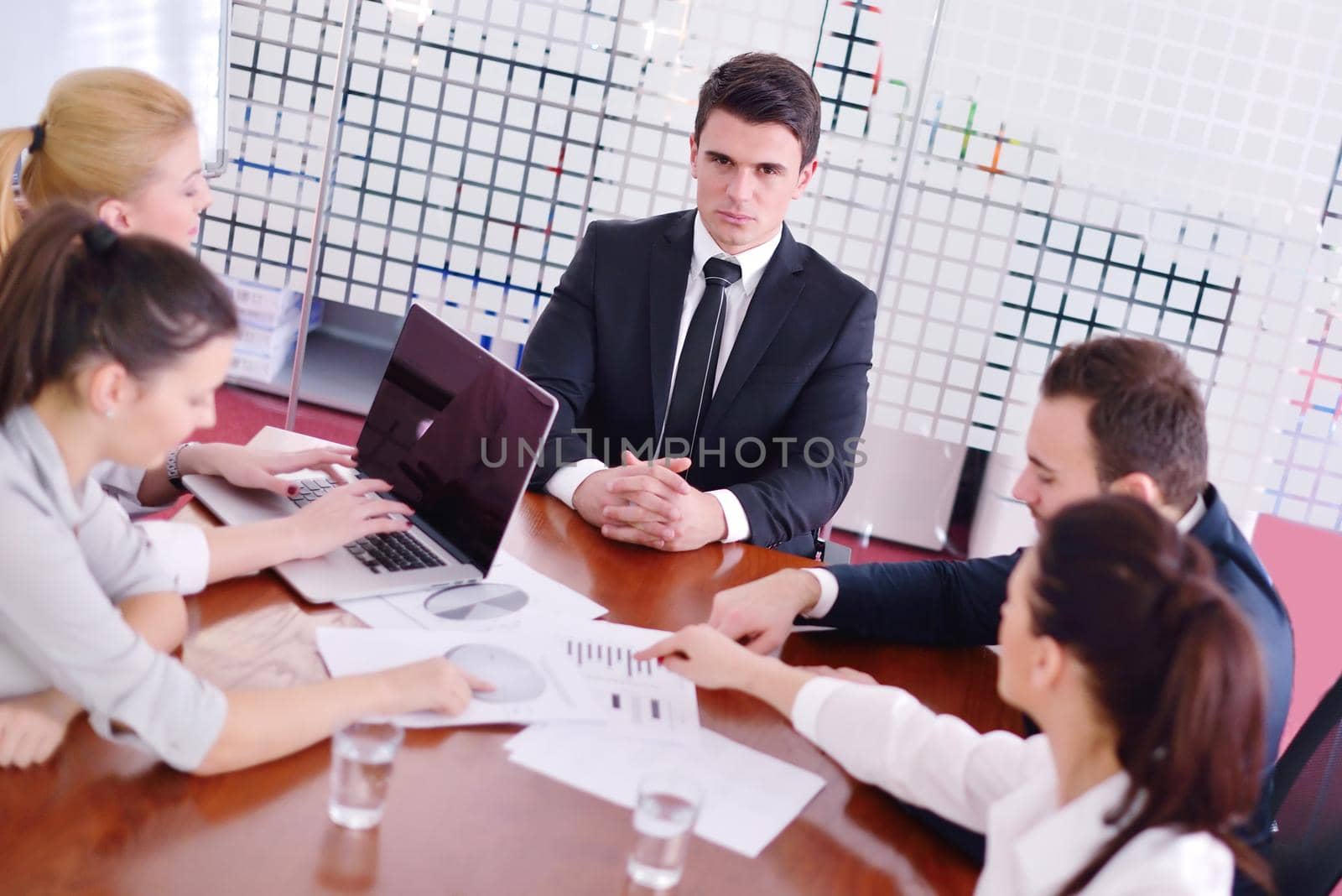 Group of happy young  business people in a meeting at office