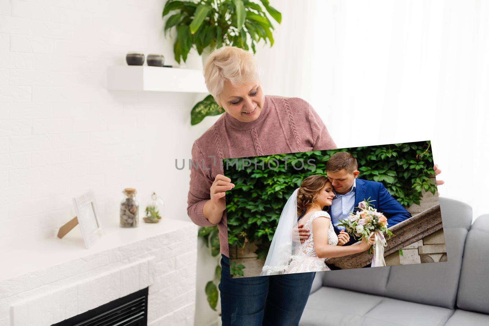 Woman holding wedding photography photo canvas print with gallery wrap. by Andelov13