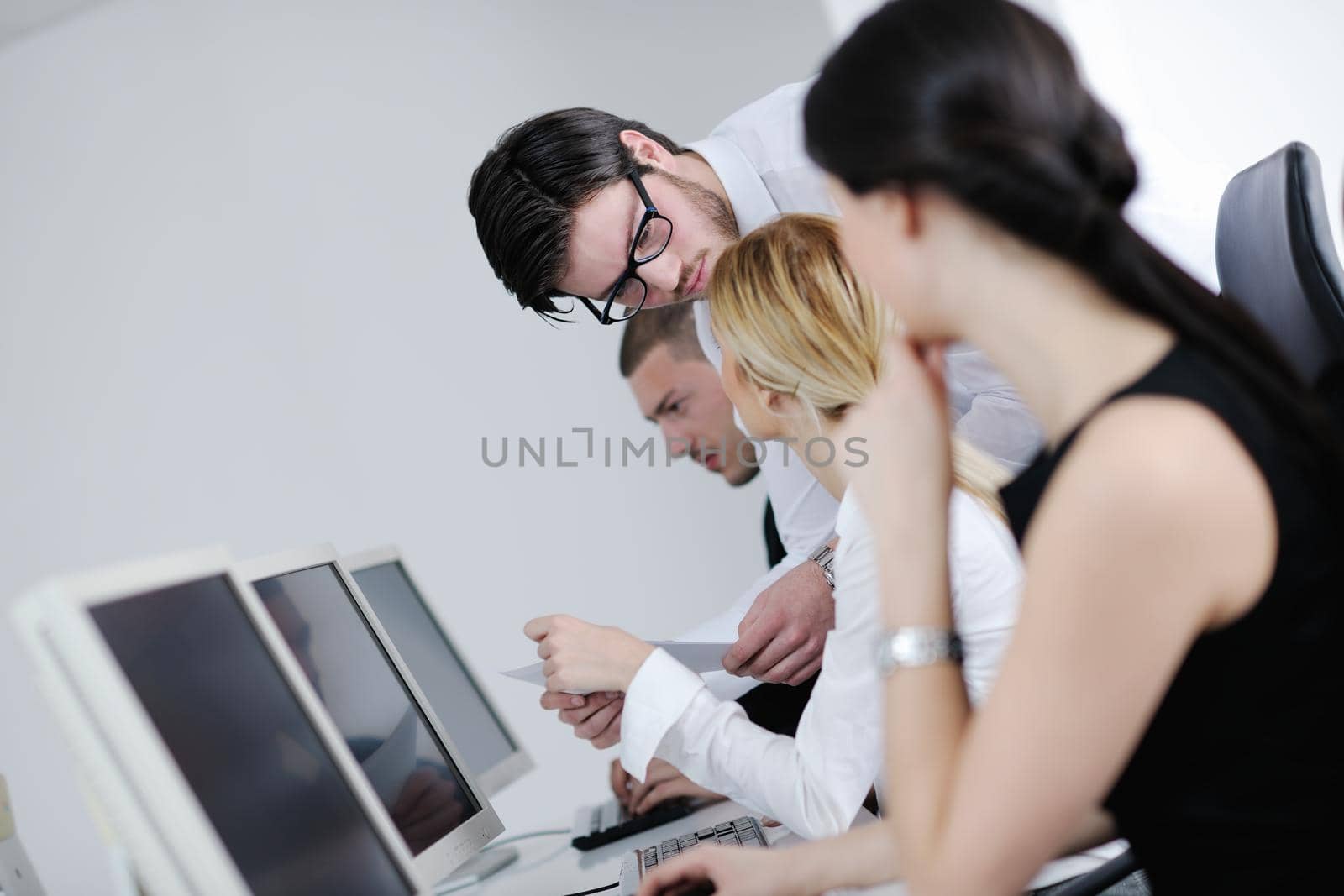 business people group with  headphones giving support in  help desk office to customers, manager giving training and education instructions