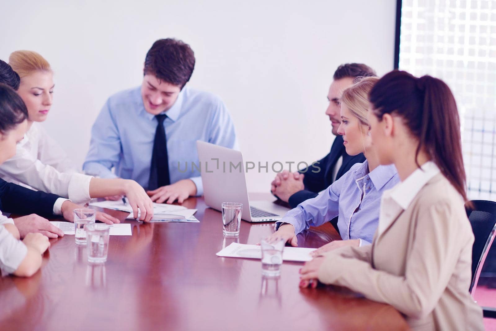 Group of happy young  business people in a meeting at office