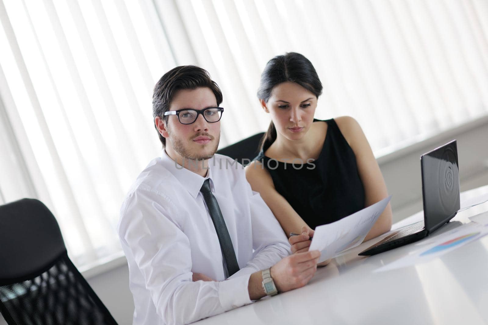 Group of happy young  business people in a meeting at office