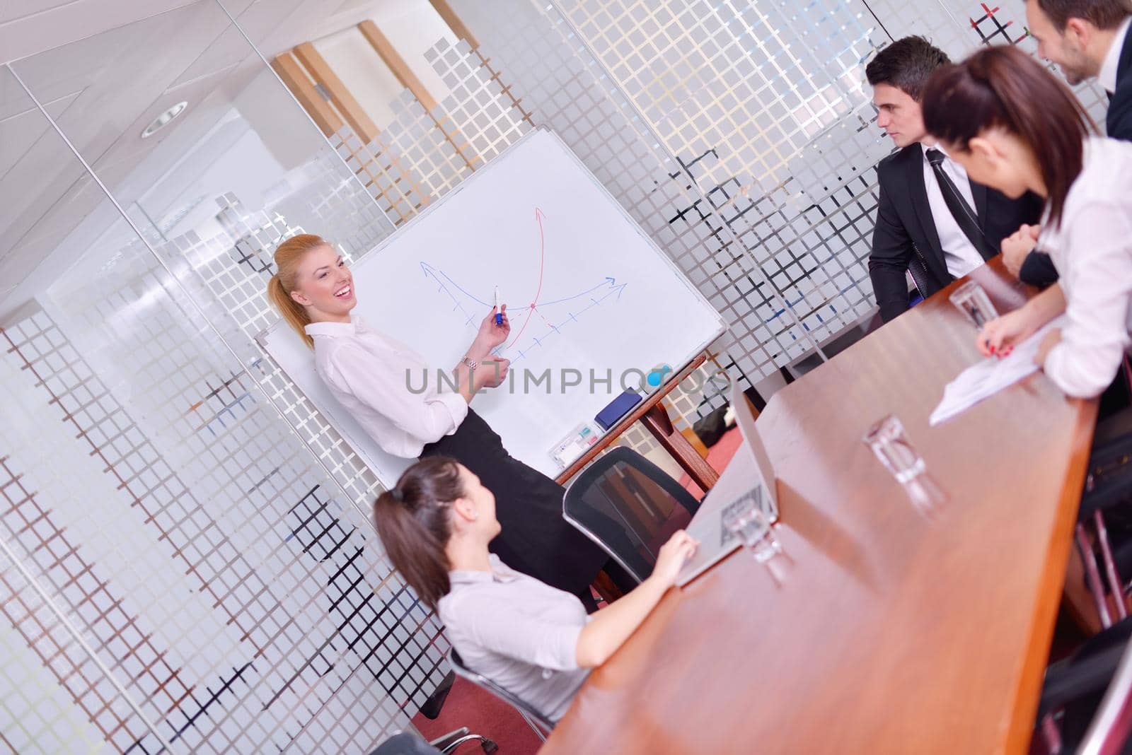 Group of happy young  business people in a meeting at office