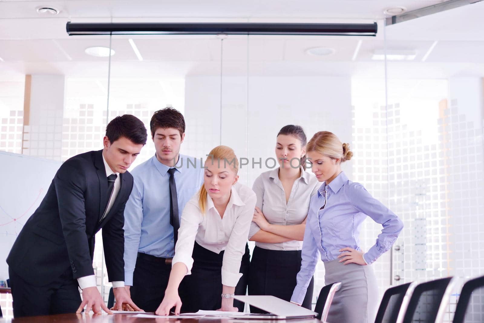 Group of happy young  business people in a meeting at office