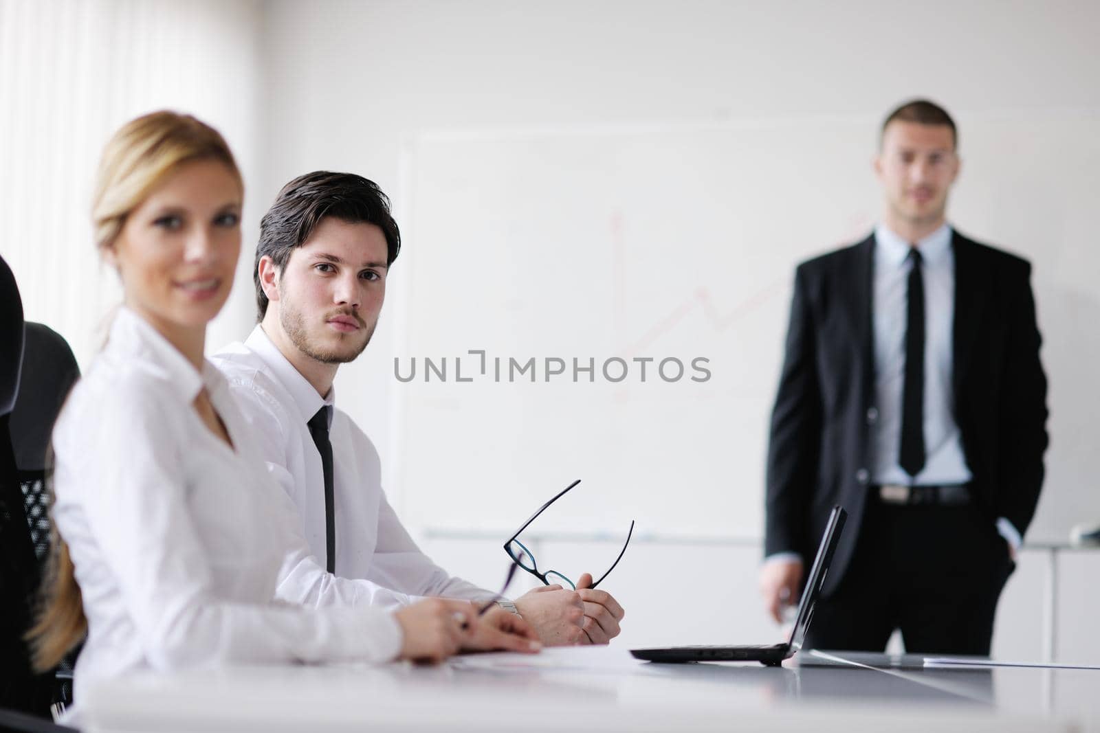 Group of happy young  business people in a meeting at office