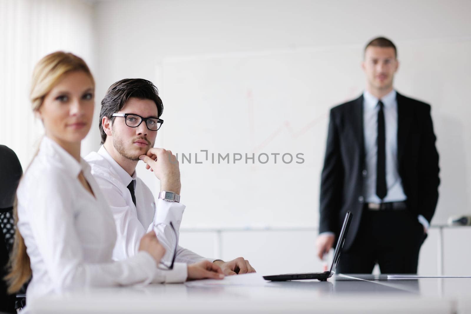 Group of happy young  business people in a meeting at office