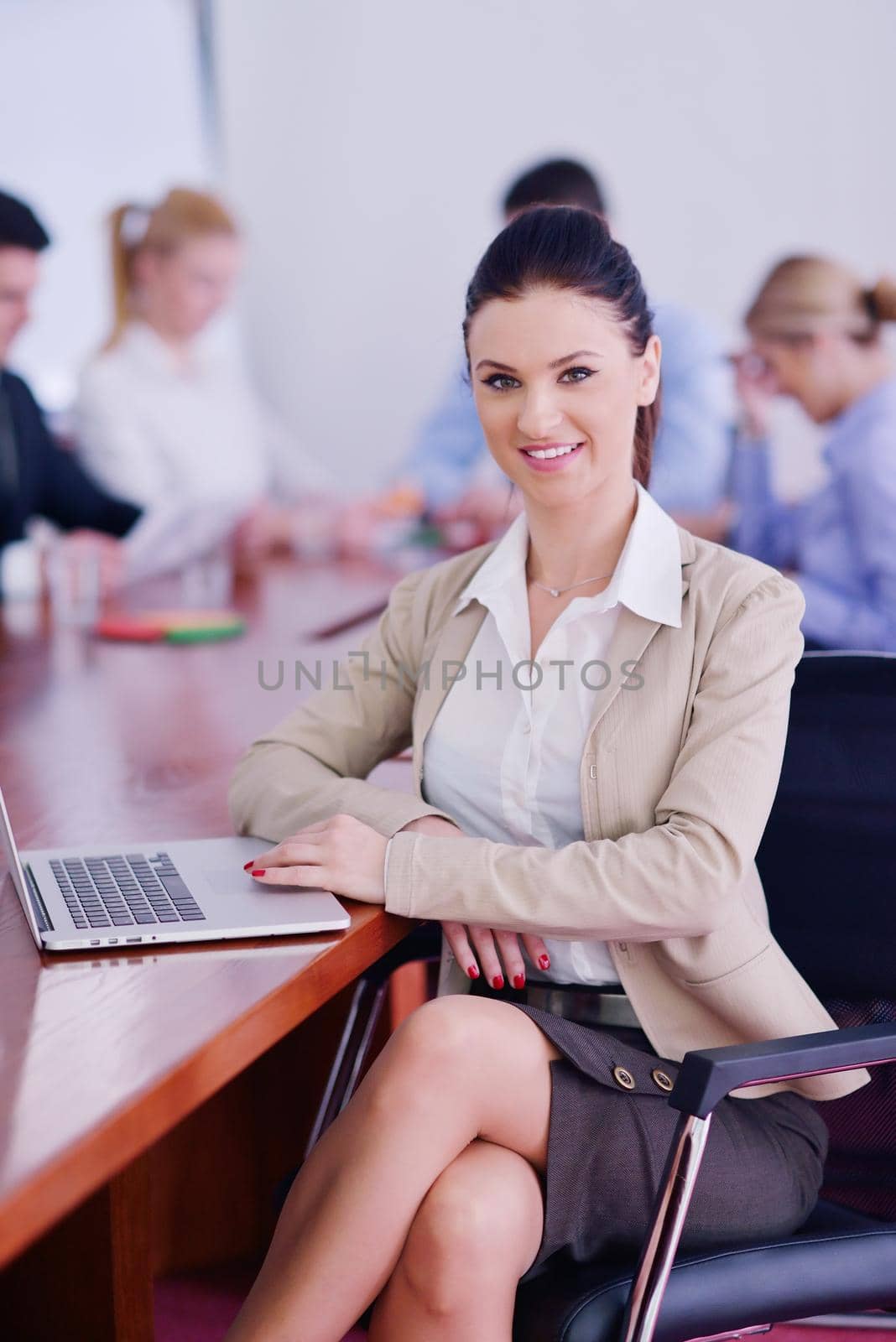 business woman  with her staff,  people group in background at modern bright office indoors