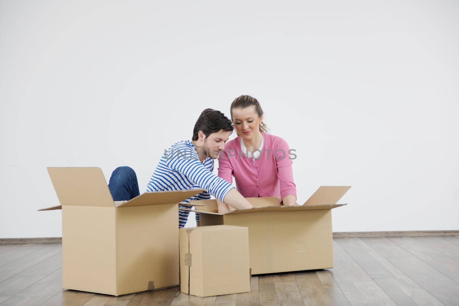 happy Young couple moving in new house