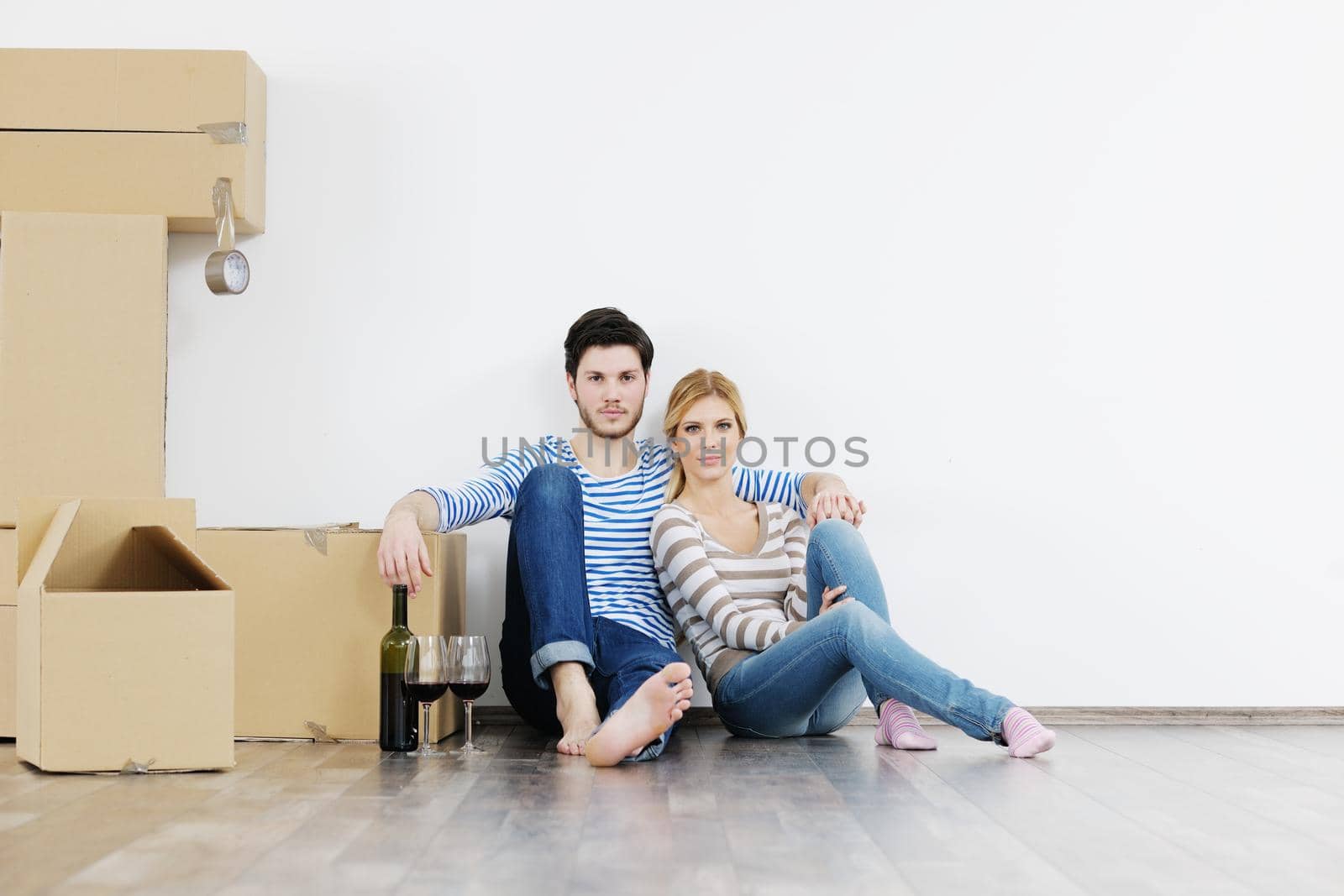 Young couple moving in new house by dotshock