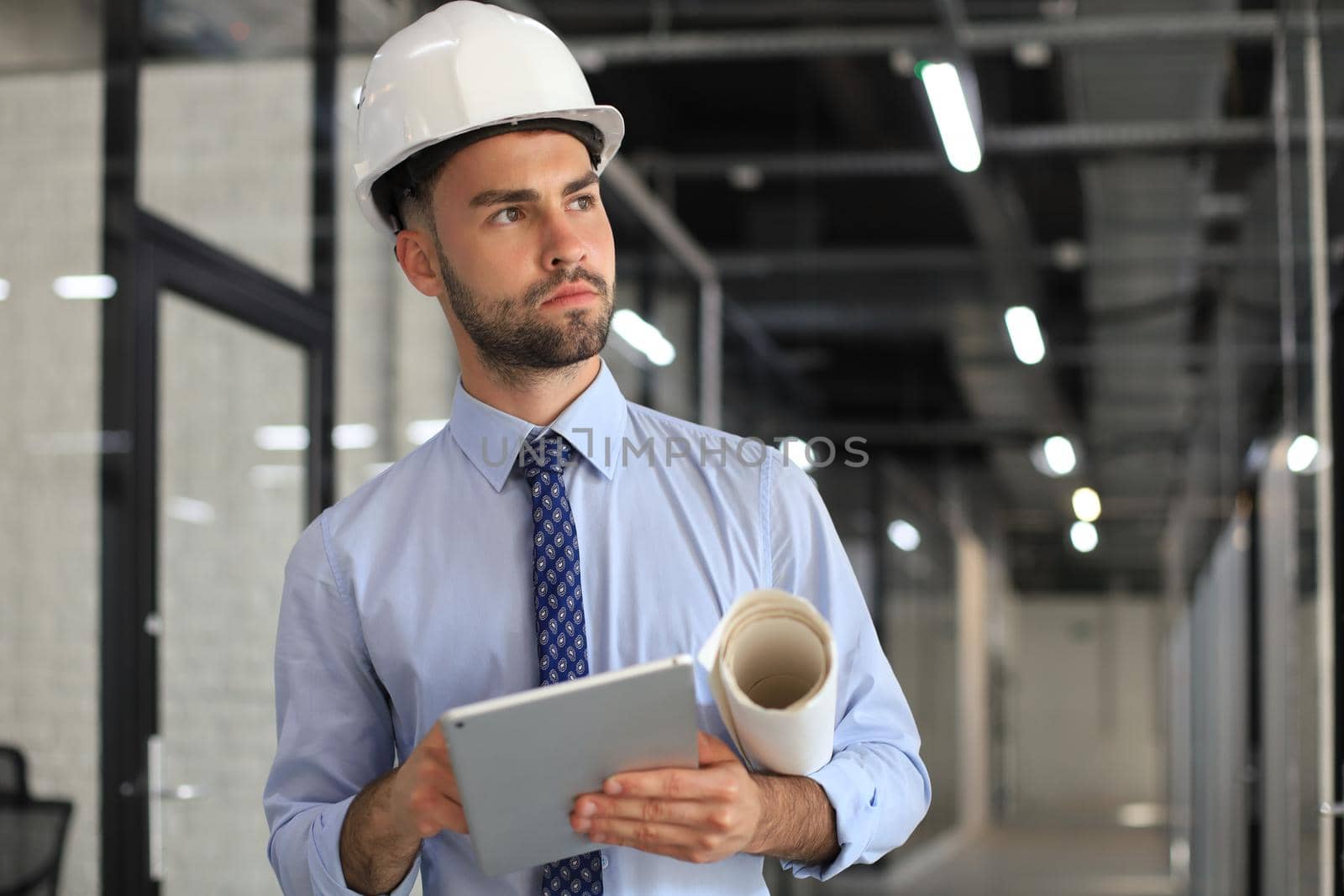 Shot of a engineer using a digital tablet on a construction site