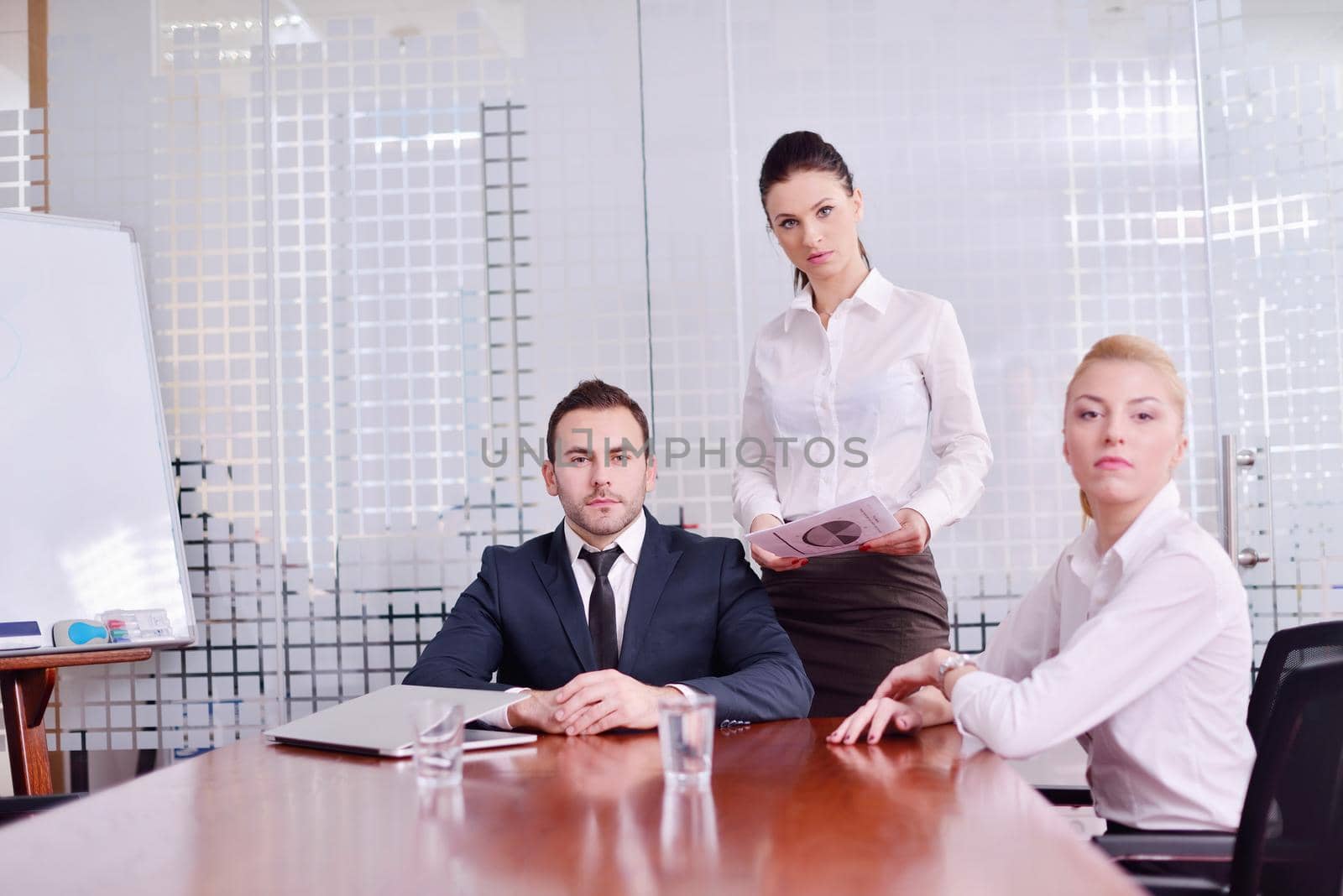 Group of happy young  business people in a meeting at office