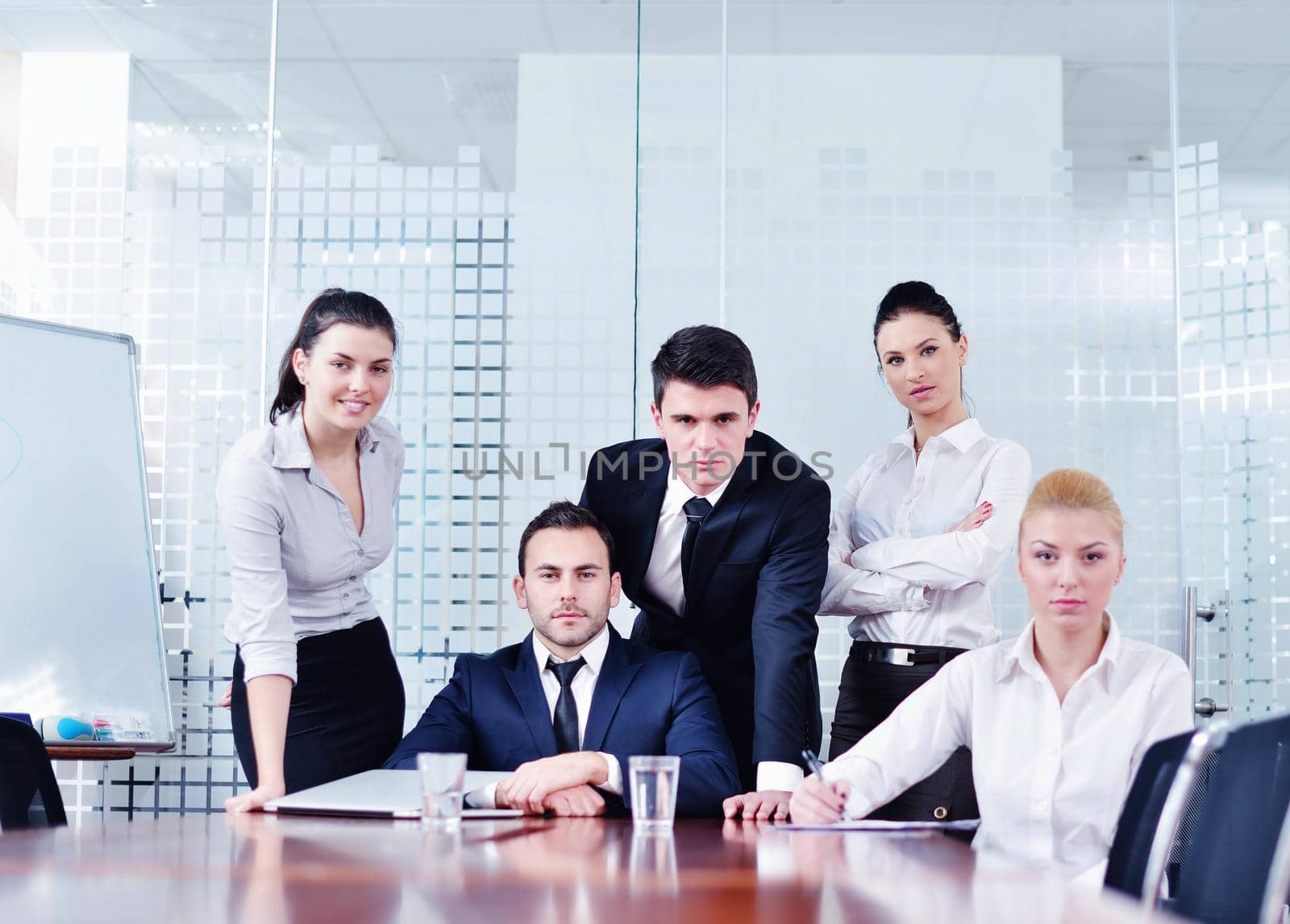 Group of happy young  business people in a meeting at office