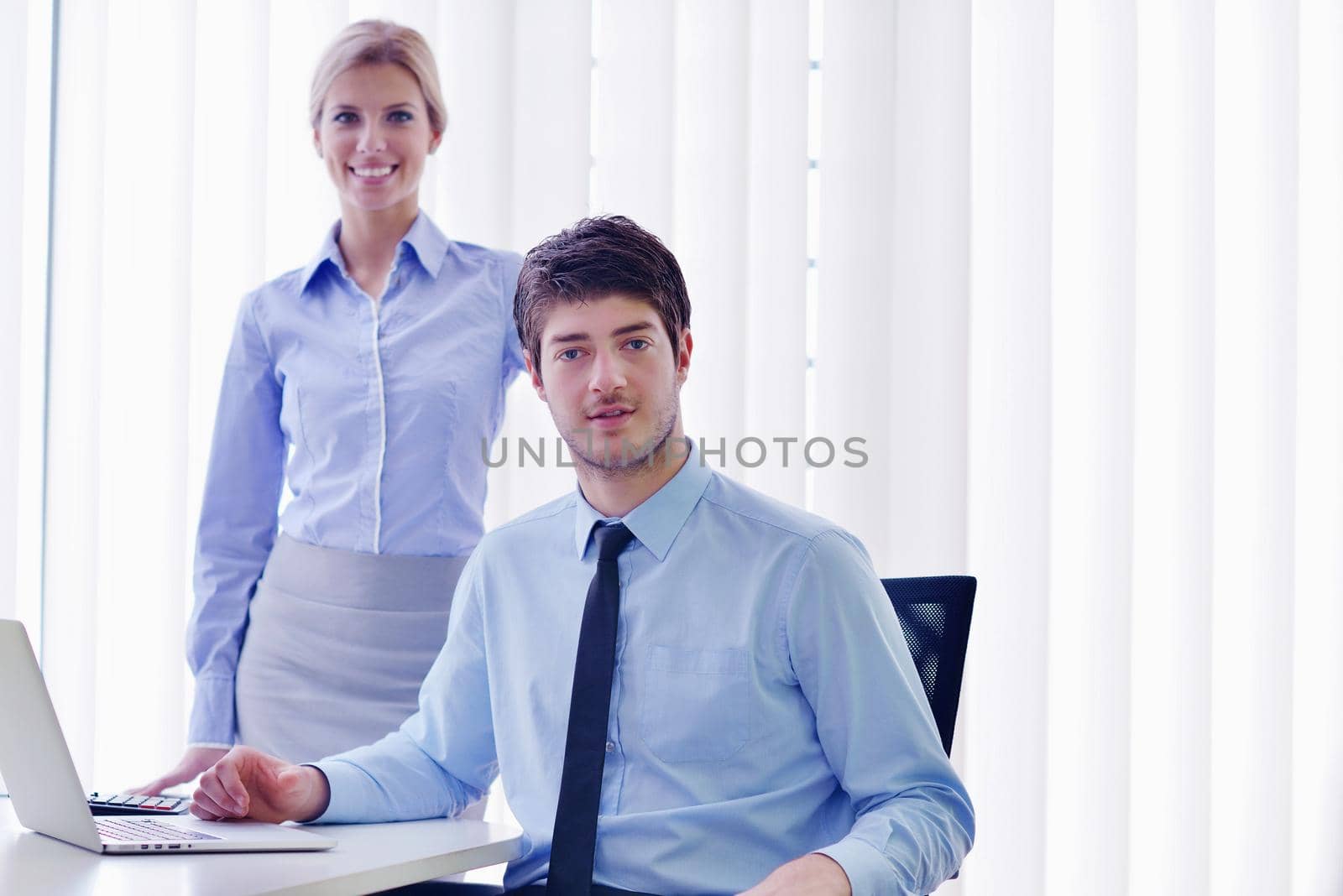 Group of happy young  business people in a meeting at office