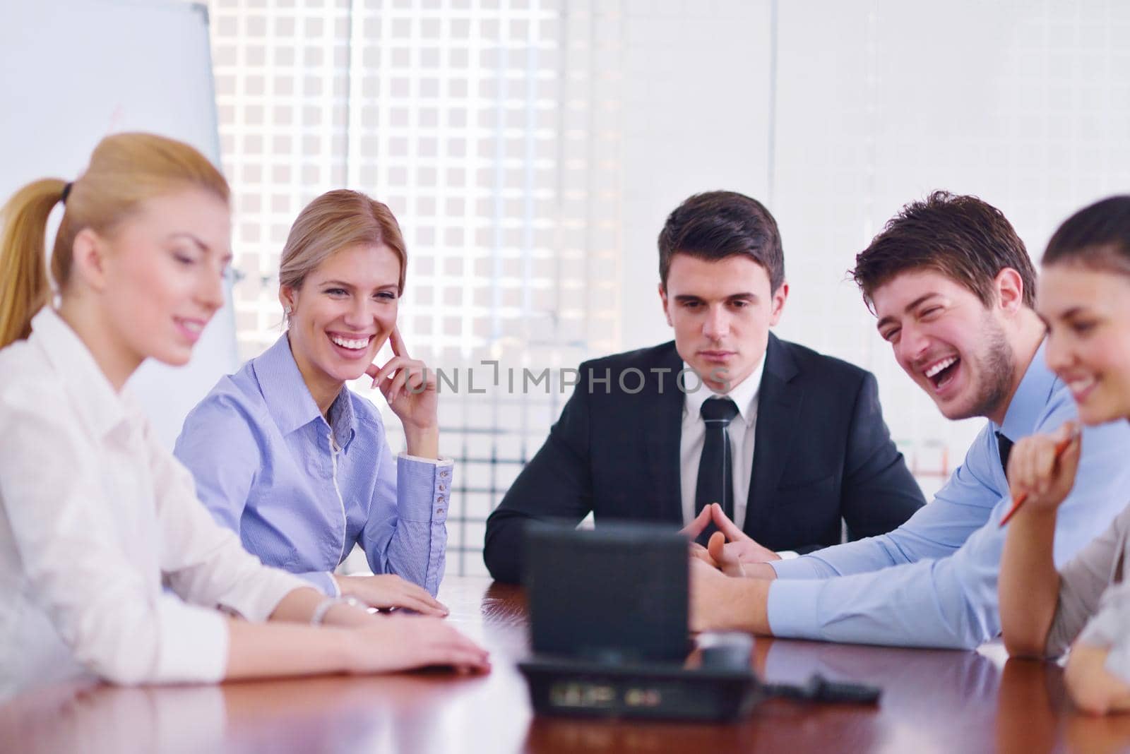 business people in a video meeting by dotshock