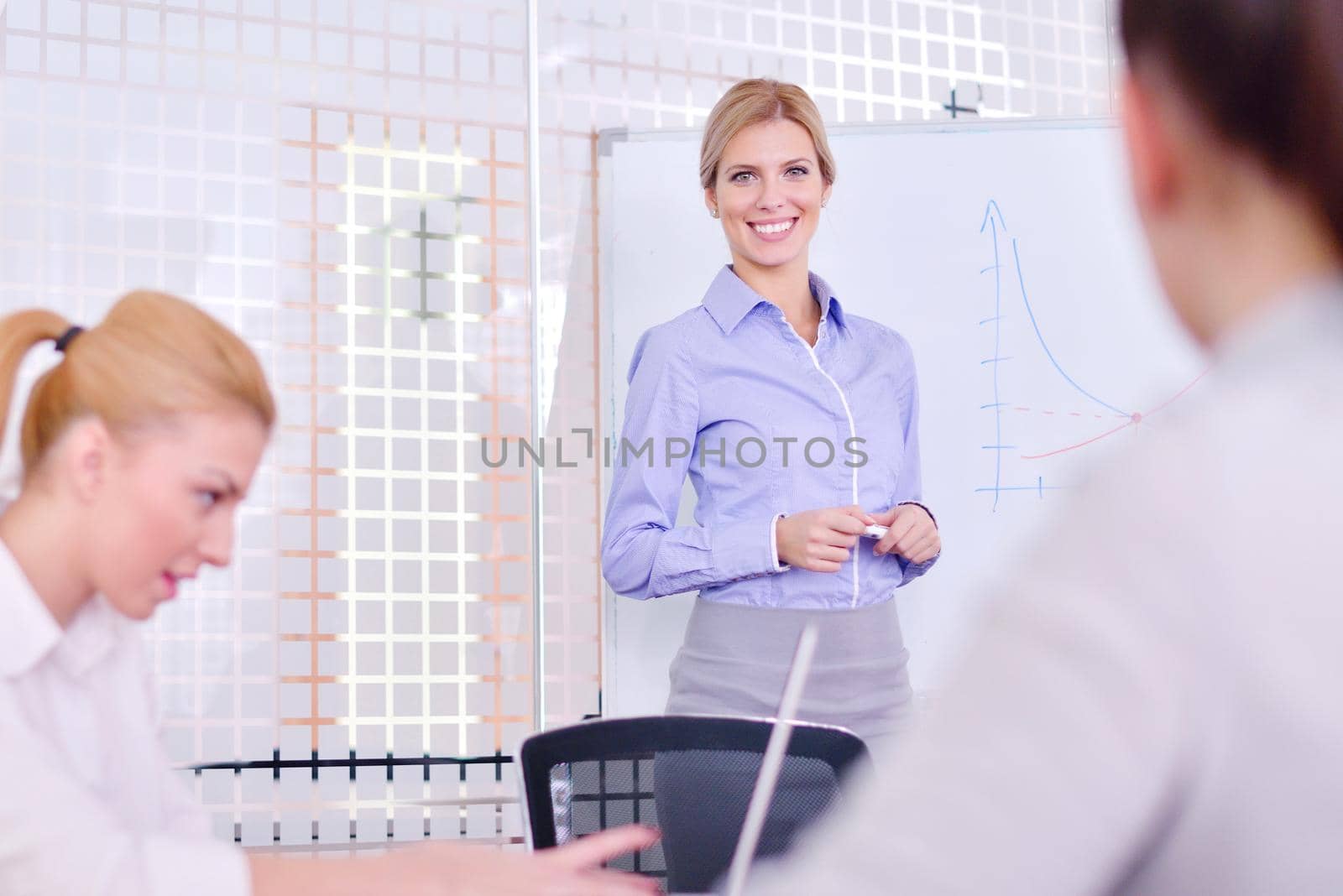 Group of happy young  business people in a meeting at office