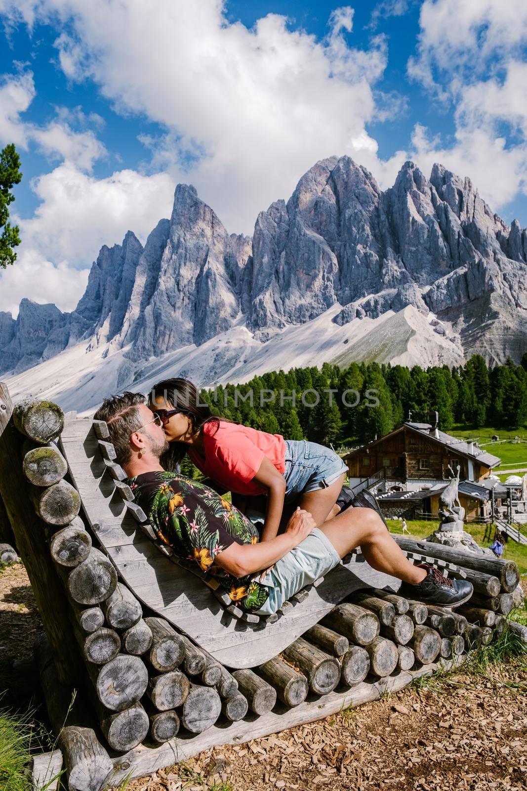 Geisler Alm, Dolomites Italy, hiking in the mountains of Val Di Funes in Italian Dolomites,Nature Park Geisler-Puez with Geisler Alm in South Tyrol. Italy Europe, couple man and woman hiking mountains