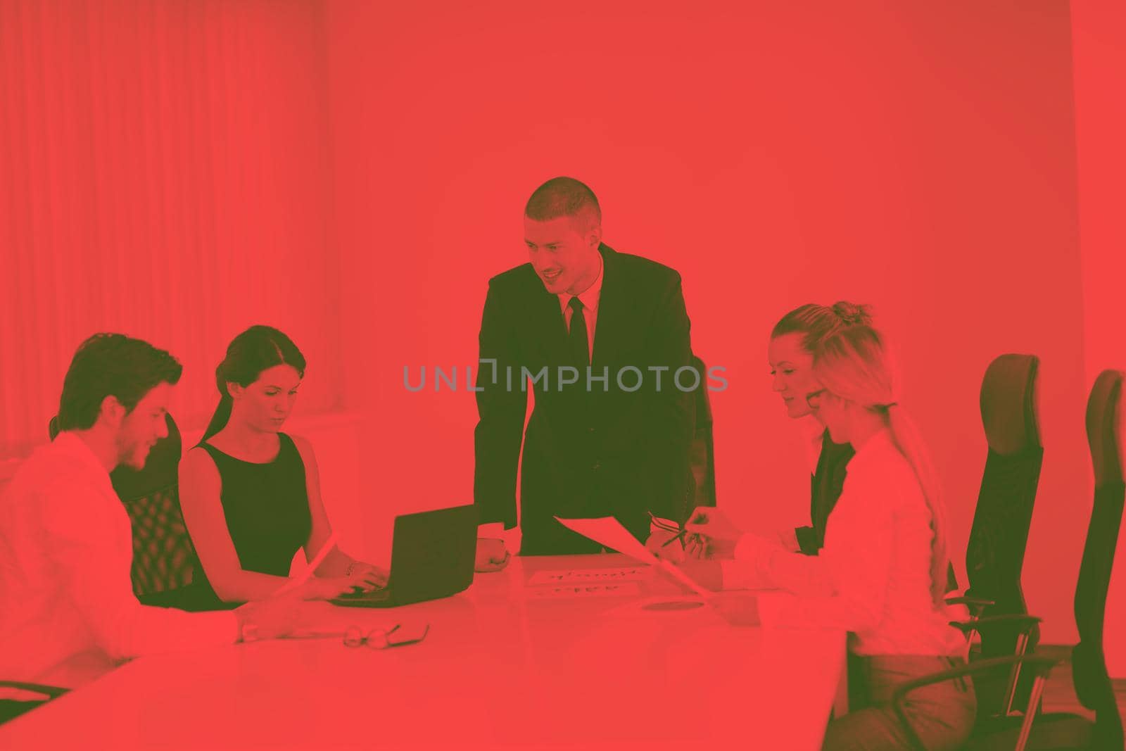 Group of happy young  business people in a meeting at office