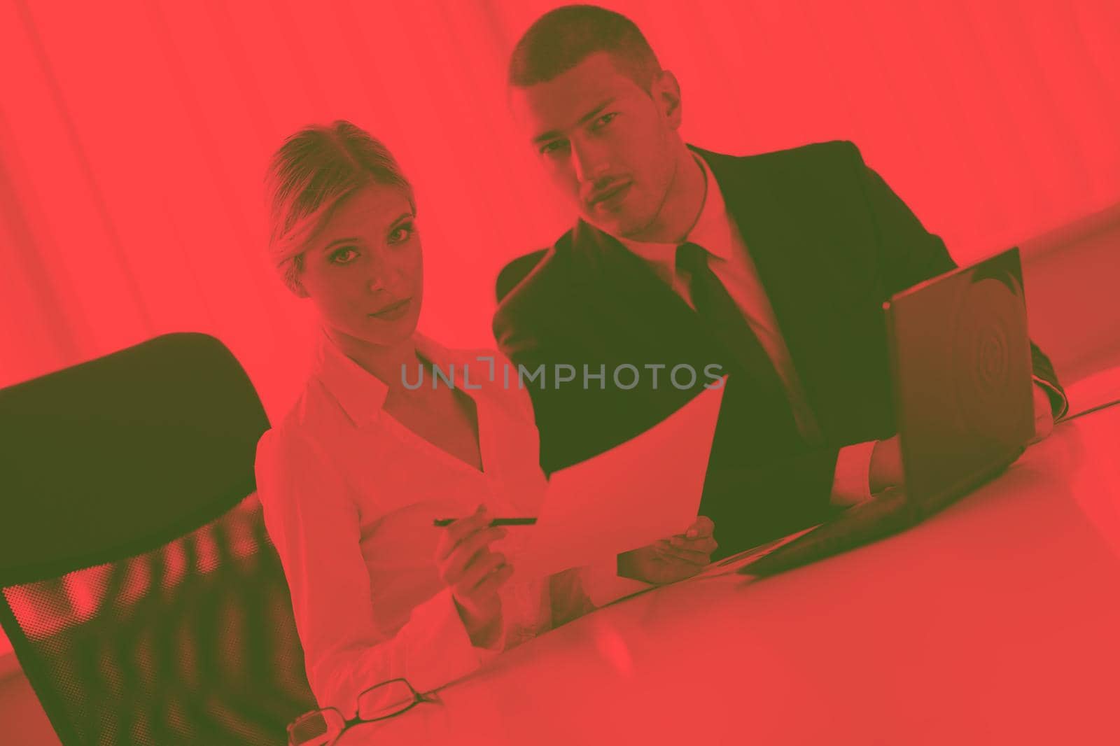 Group of happy young  business people in a meeting at office