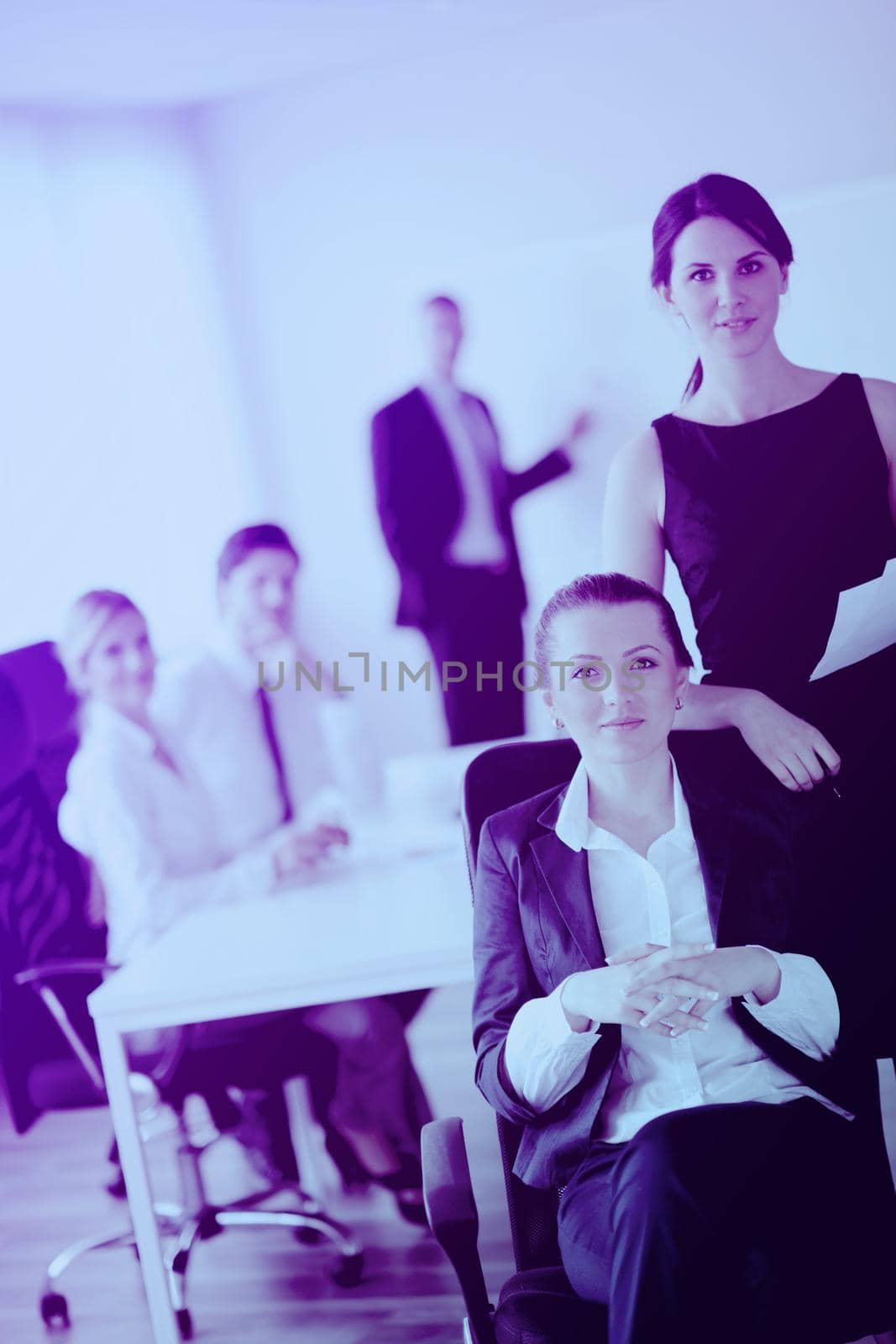 business woman  with her staff,  people group in background at modern bright office indoors