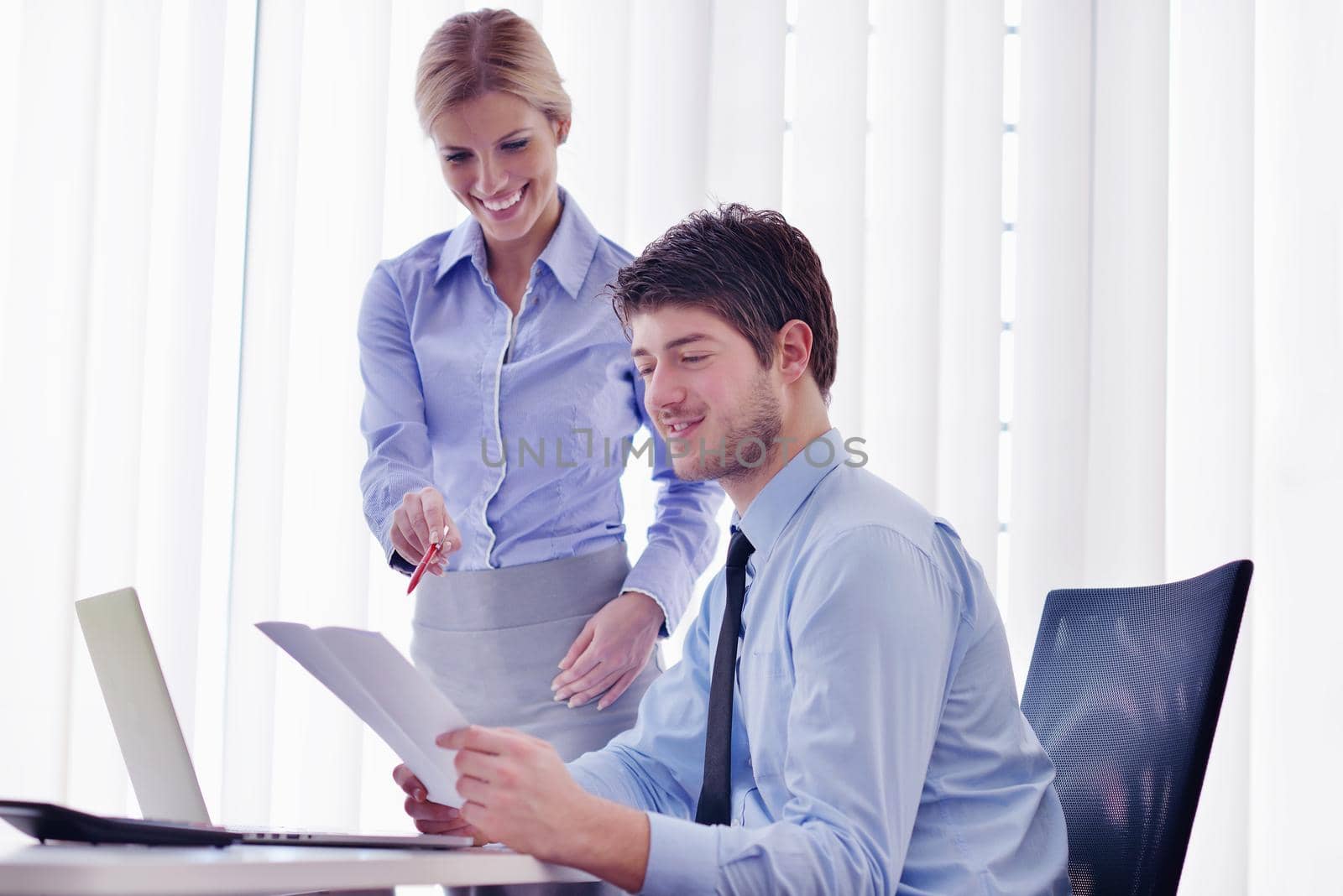 Group of happy young  business people in a meeting at office