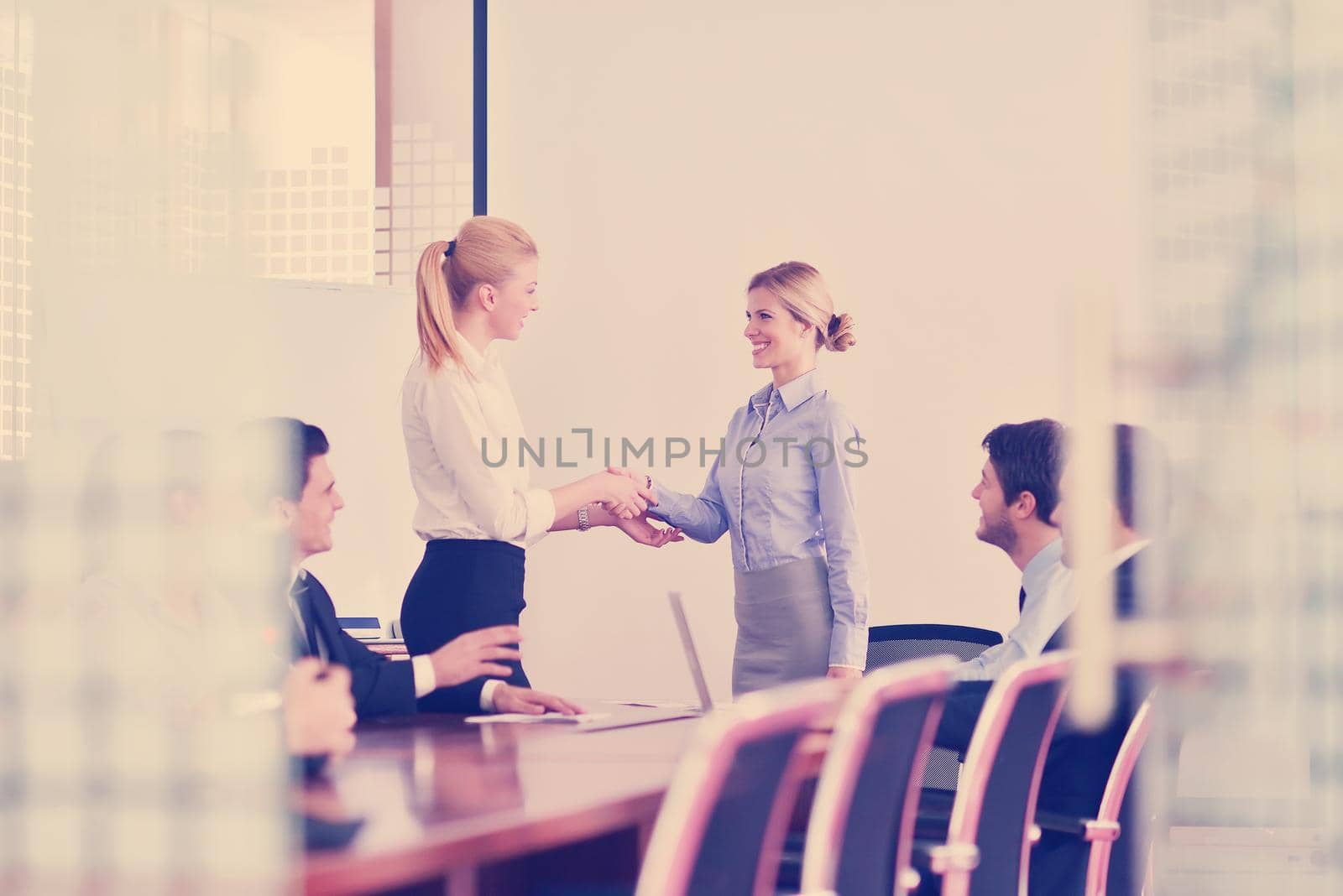 Group of happy young  business people in a meeting at office