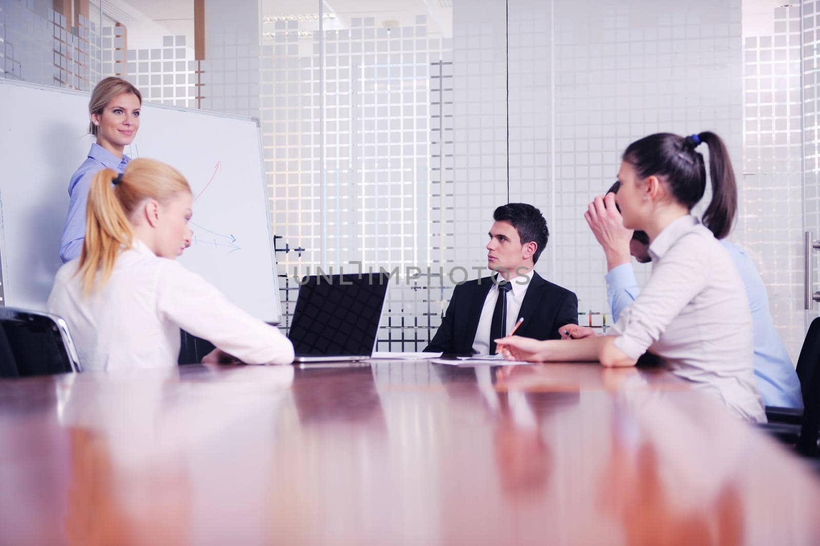 Group of happy young  business people in a meeting at office