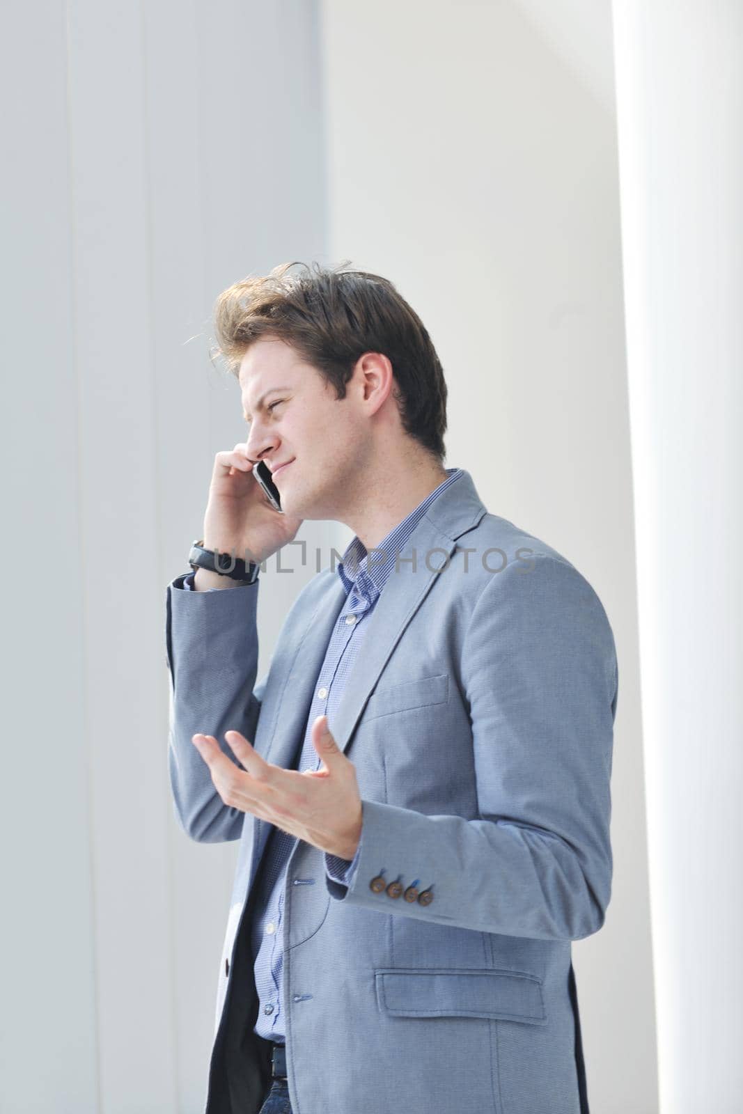 young business man lawyer with laptop alone in big bright   conference room