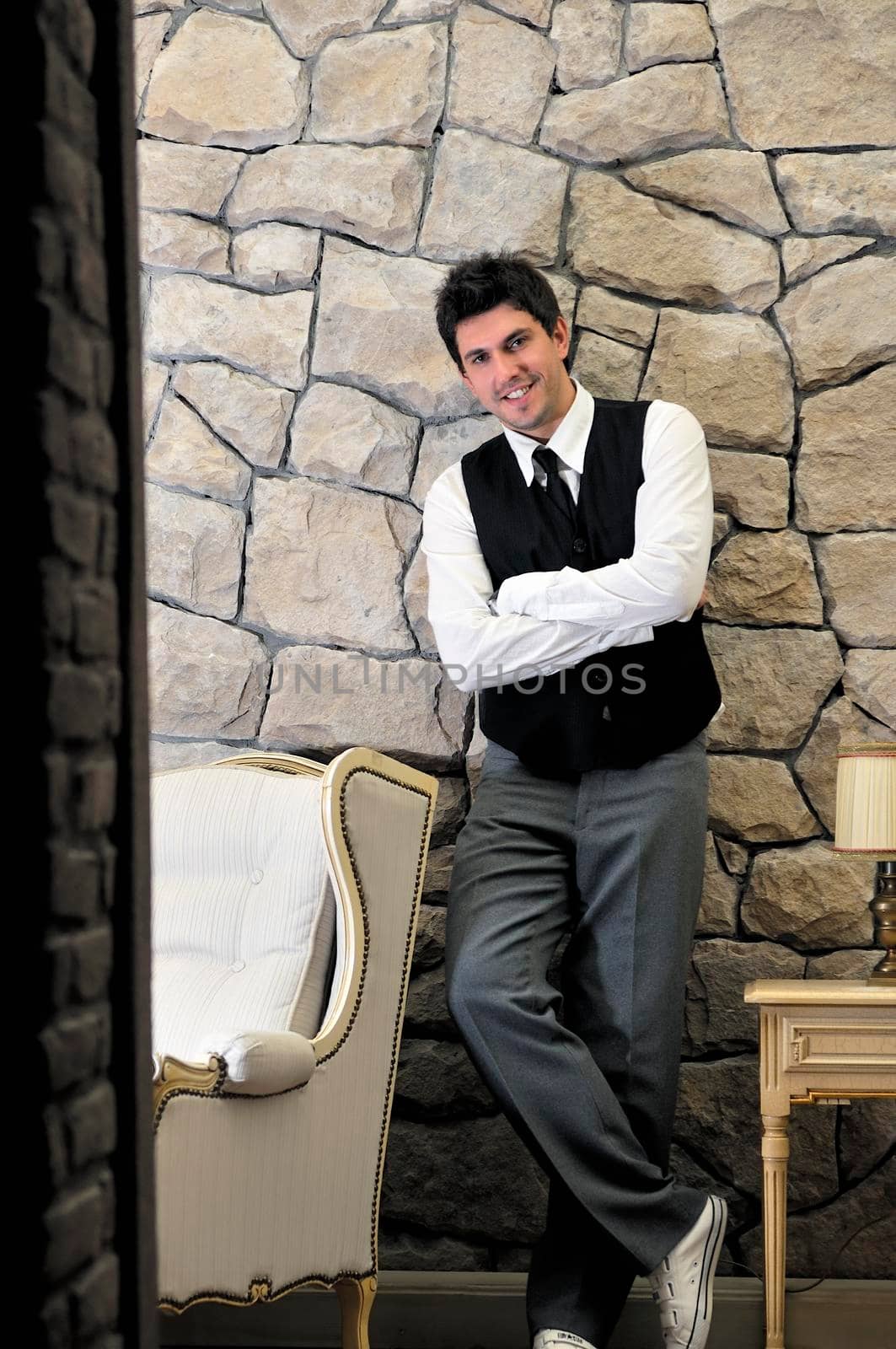 indoor portrait of young and happy  businessman  by dotshock