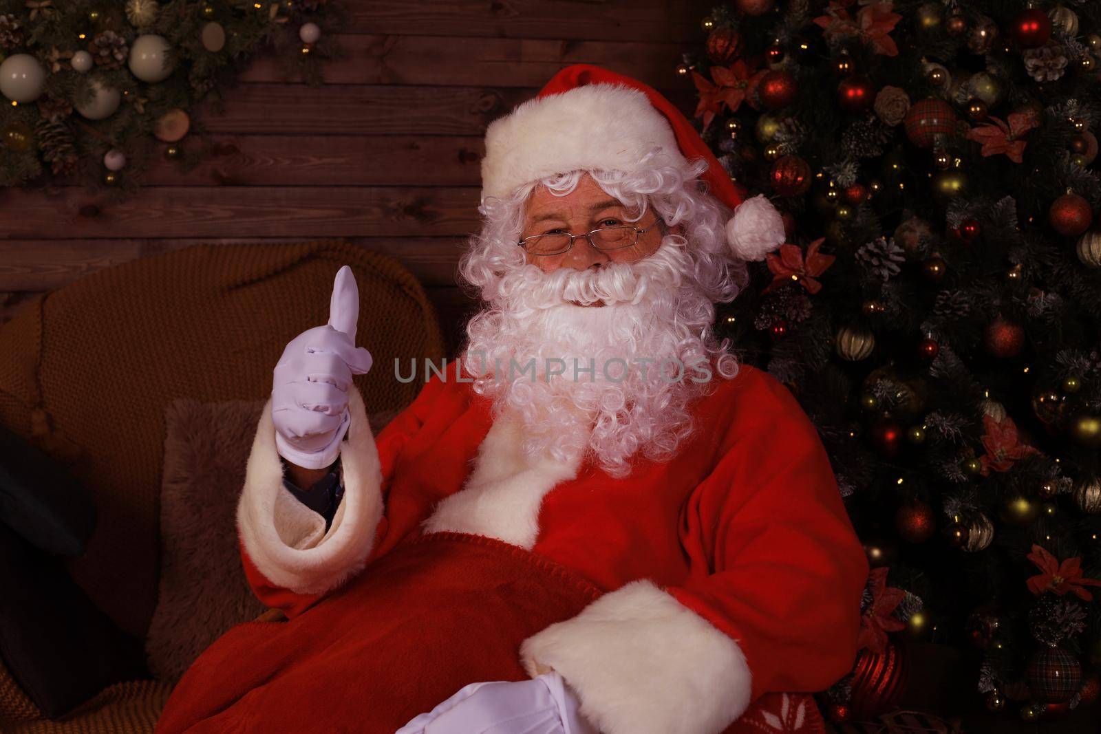 Santa Claus standing with thumbs up. Home decoration