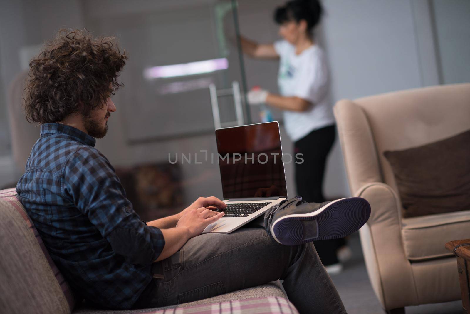 man working with laptop by dotshock