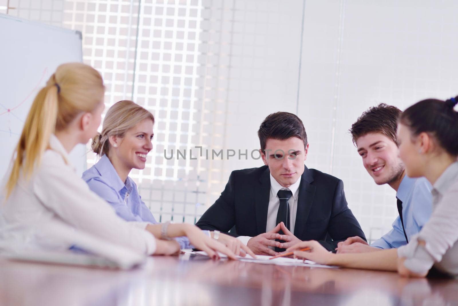 Group of happy young  business people in a meeting at office