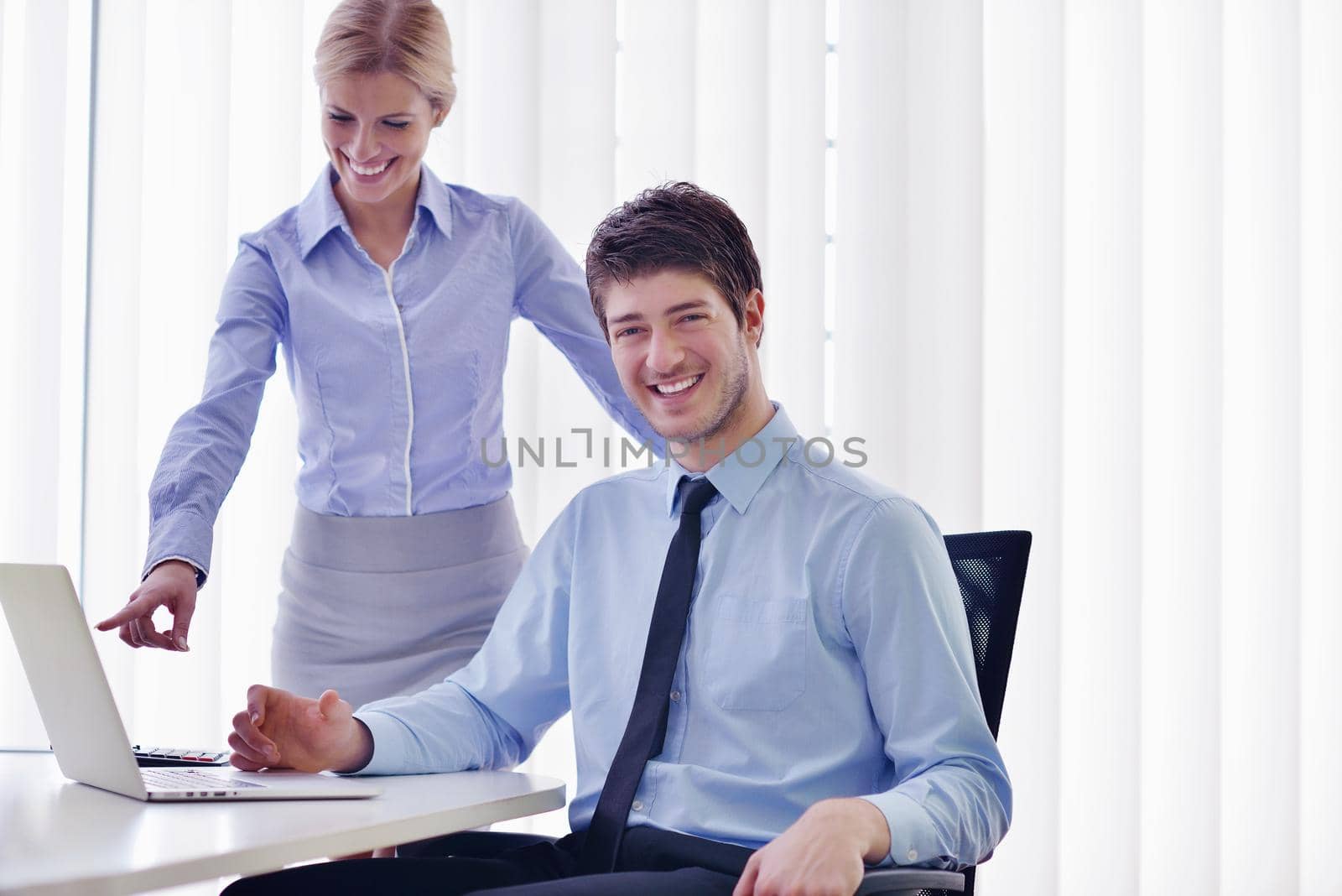 Group of happy young  business people in a meeting at office