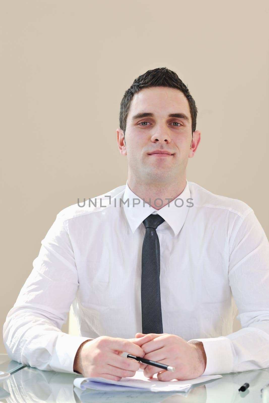 young business man lawyer with laptop alone in big bright   conference room