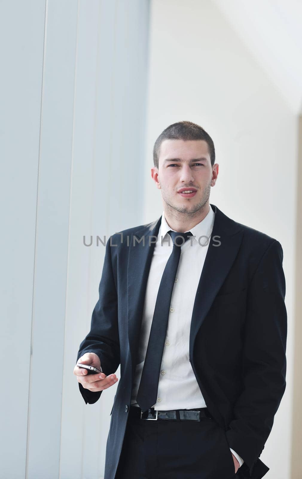 young business man talk by cellphone by dotshock