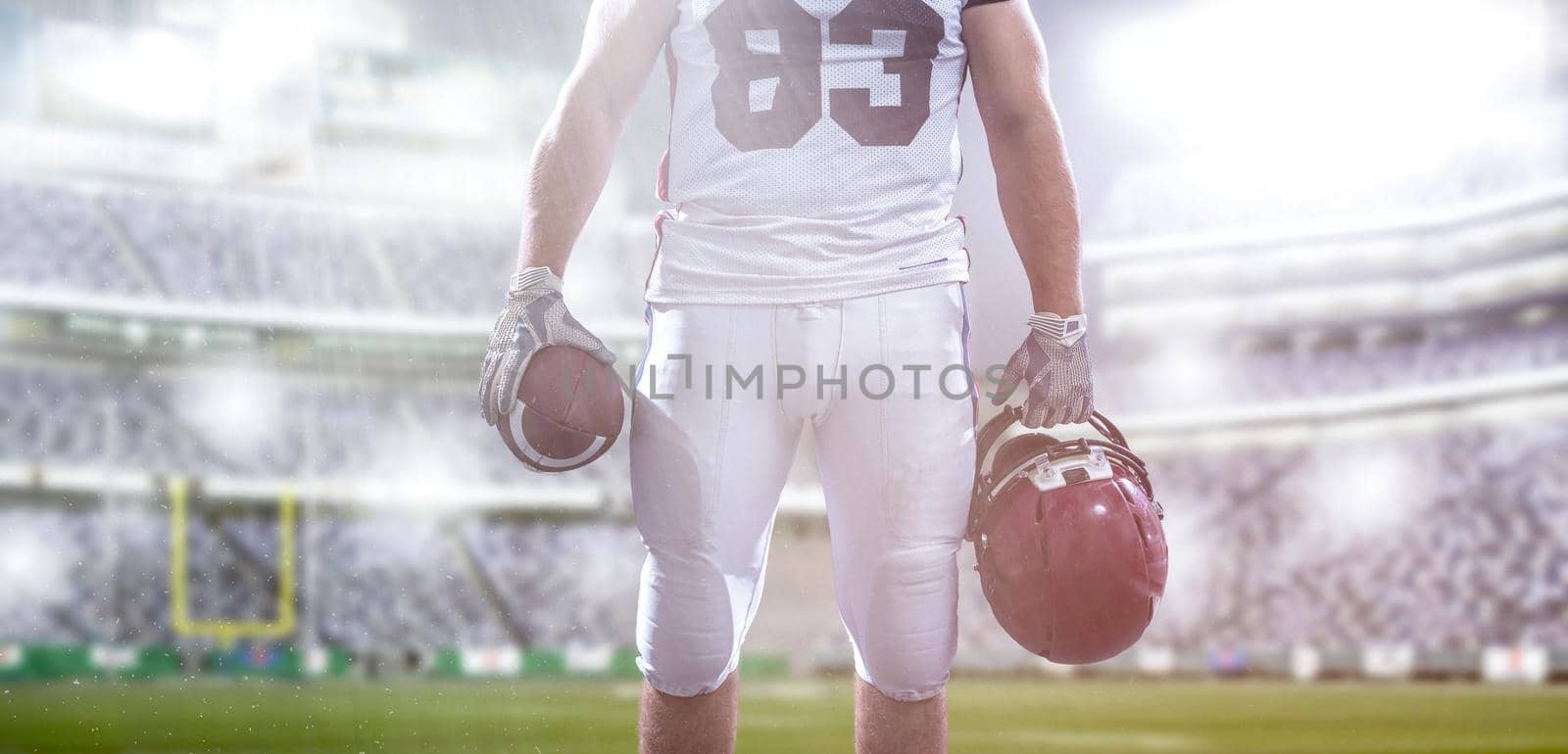 closeup American Football Player isolated on big modern stadium by dotshock