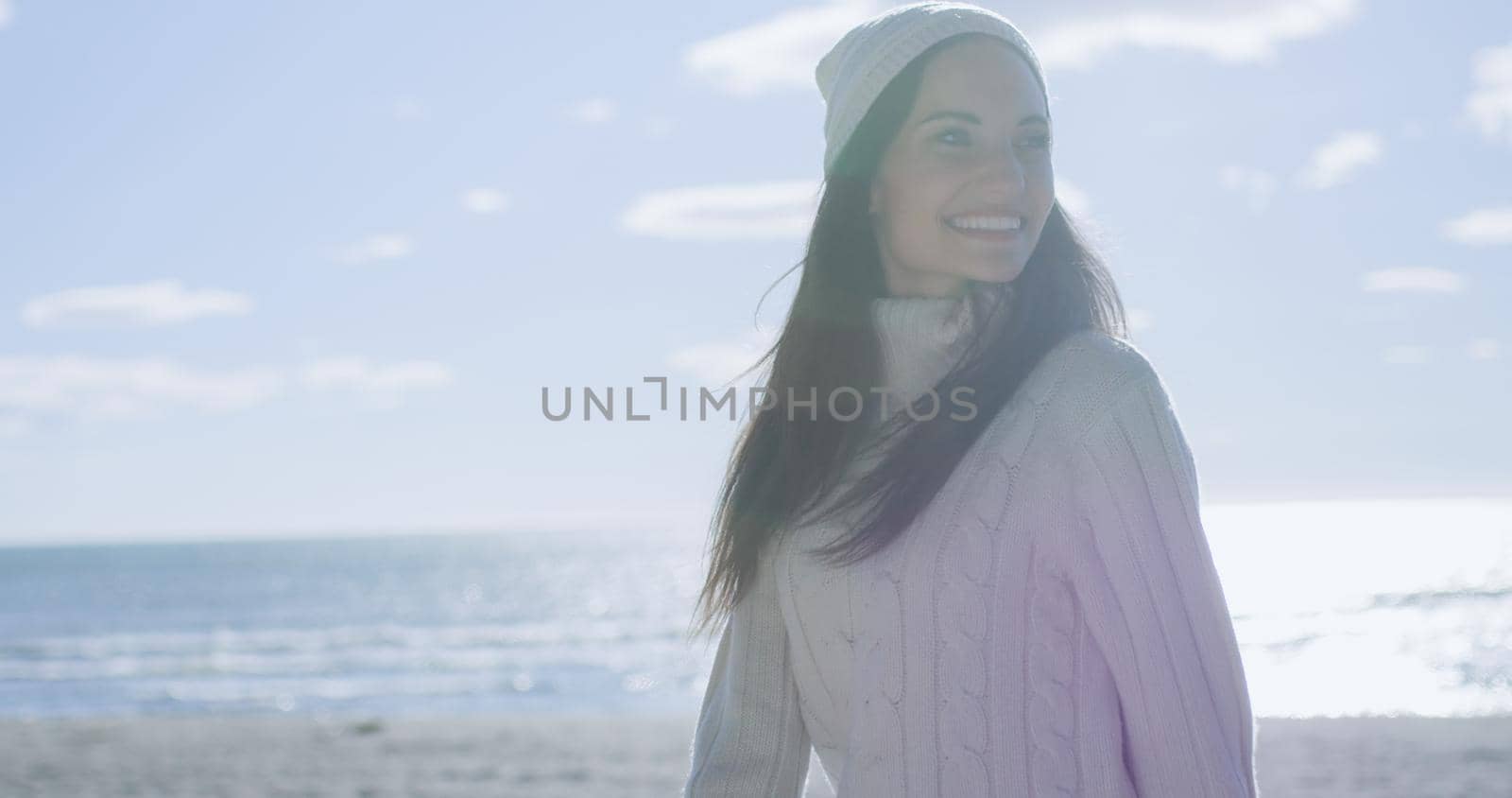 Girl In Autumn Clothes Smiling on beach by dotshock