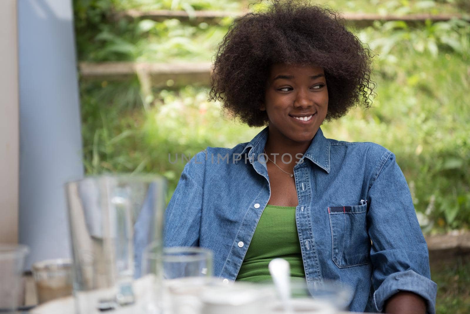 Portrait of Beautiful happy African-American girl sitting outside